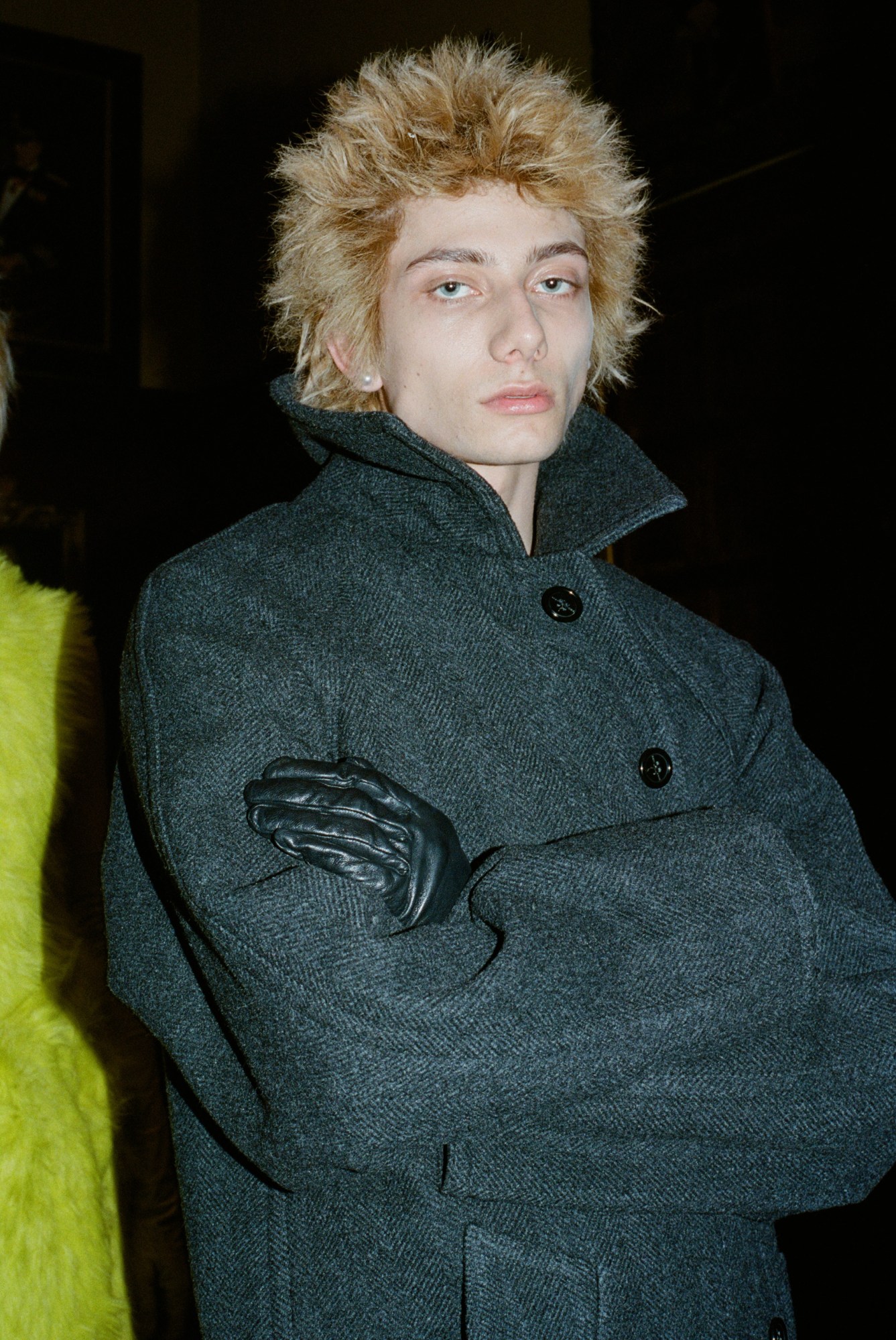 a blonde spiky haired model in a wool overcoat at marc jacobs AW23