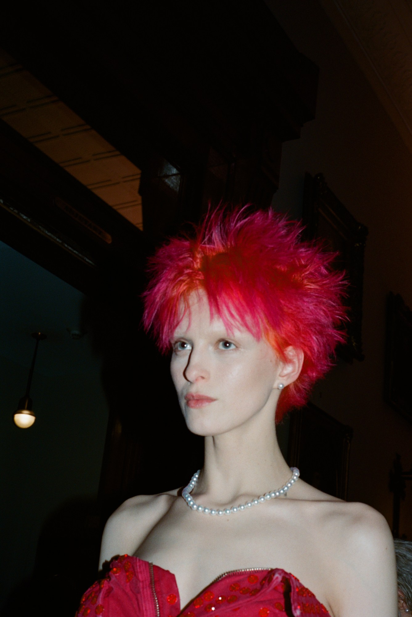 model with pink spiky hair and pink dress and pearl necklace at marc jacobs aw23