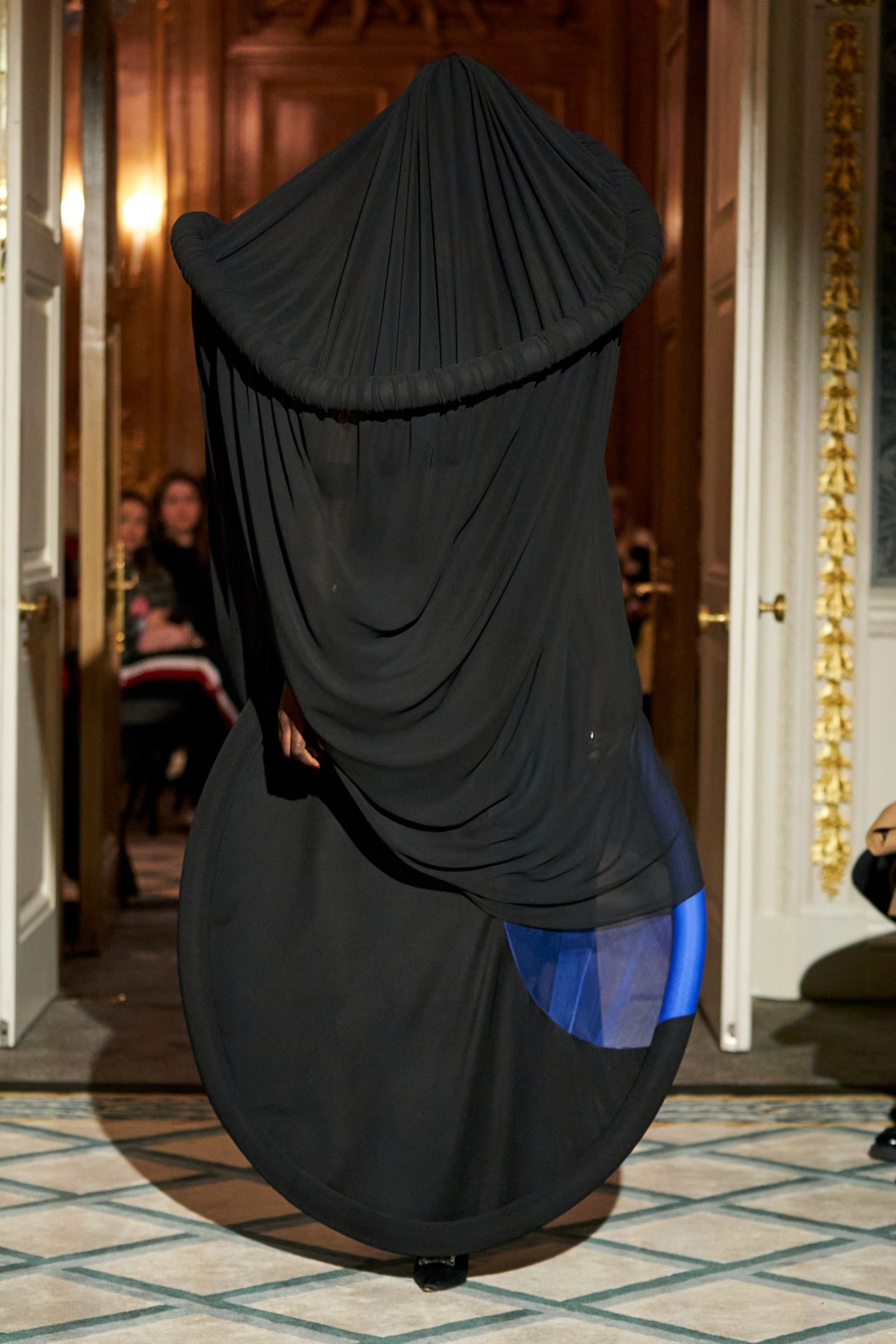 Model walking in a black structured gown at Roksanda AW23