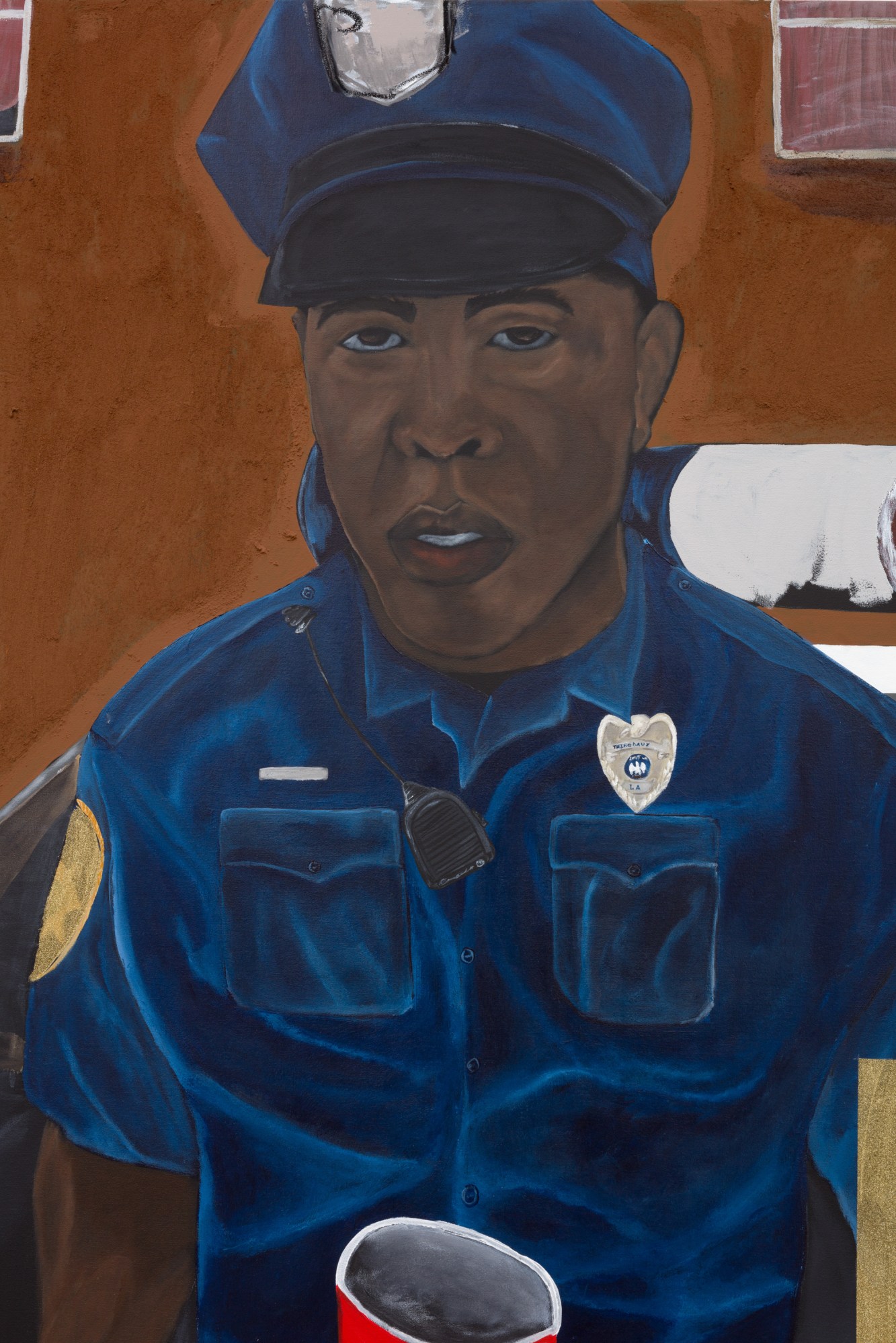 A Black police officer in a blue uniform.