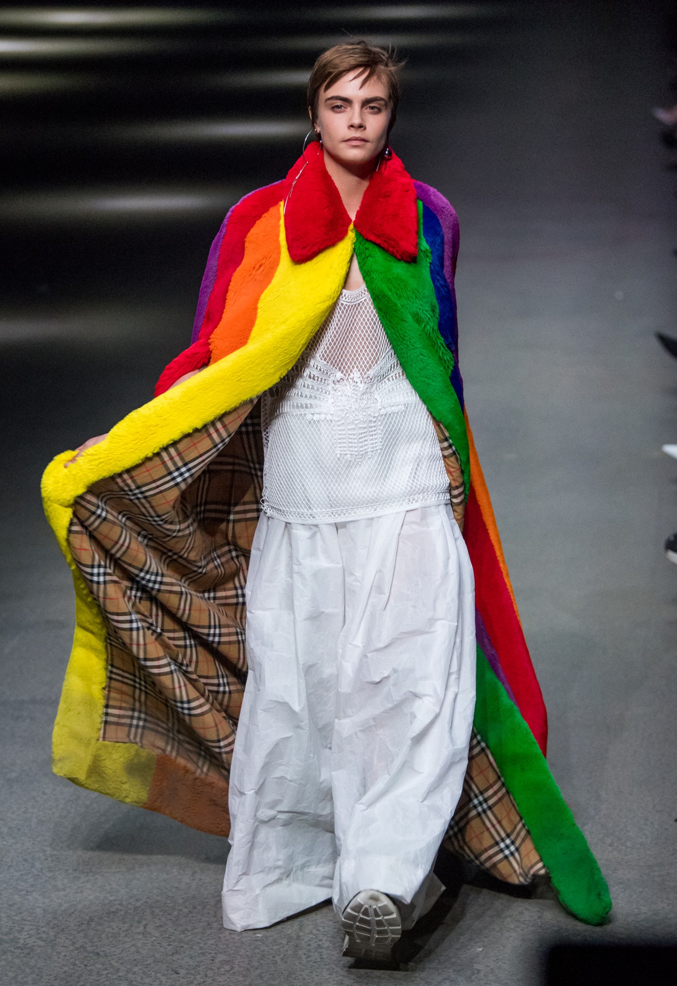 Cara Delevingne walks the runway at the Burberry show during London Fashion Week February