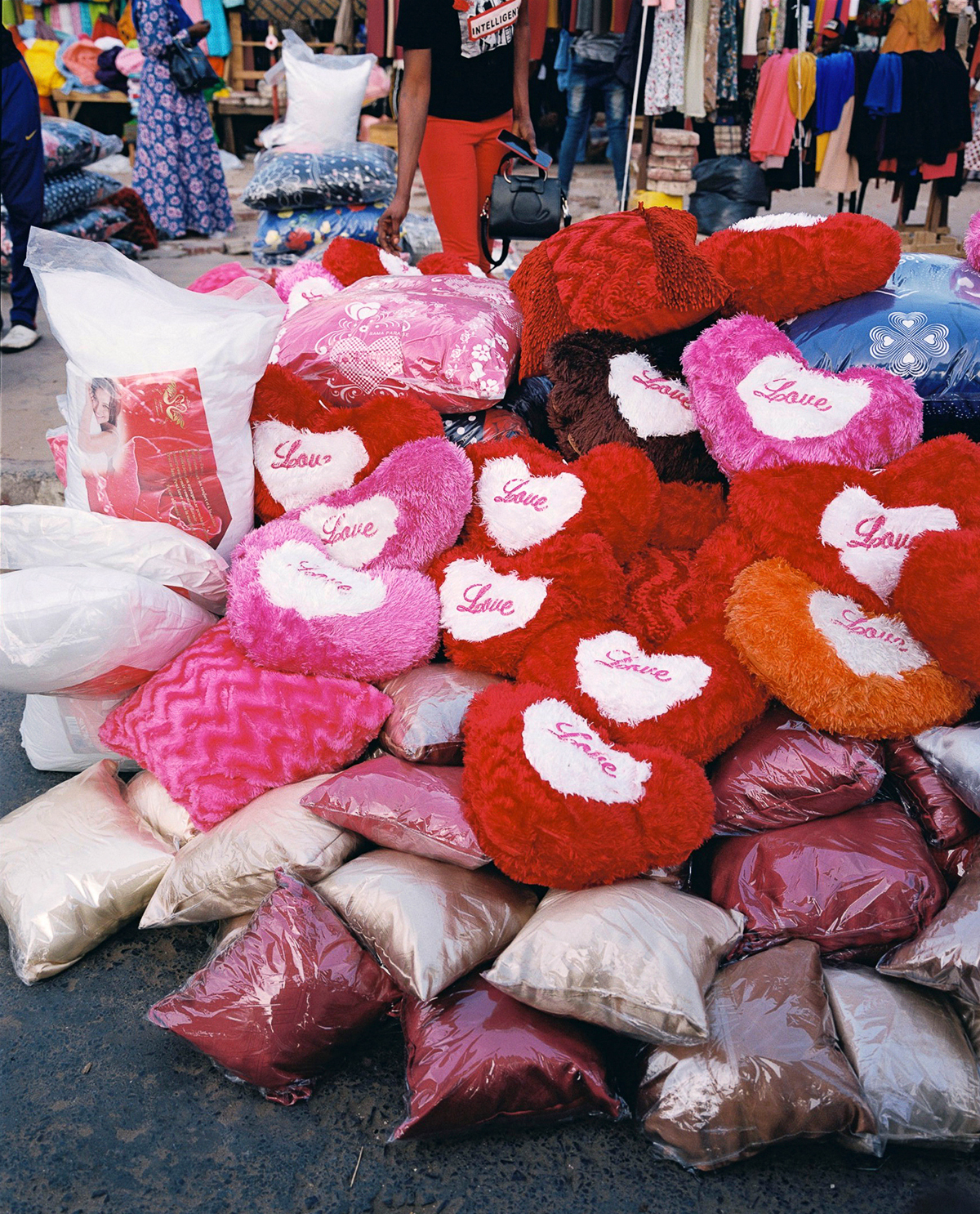 heart shaped pillows in a pile in the market in senegal