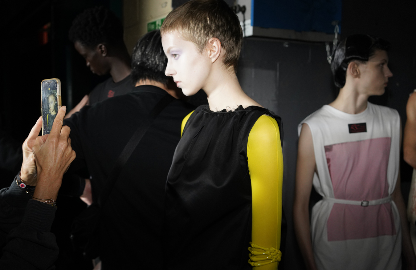 Photograph of models backstage at the Raf Simons SS23 show by Nick Waplington for i-D’s The Timeless Issue, no. 371, Spring 2023