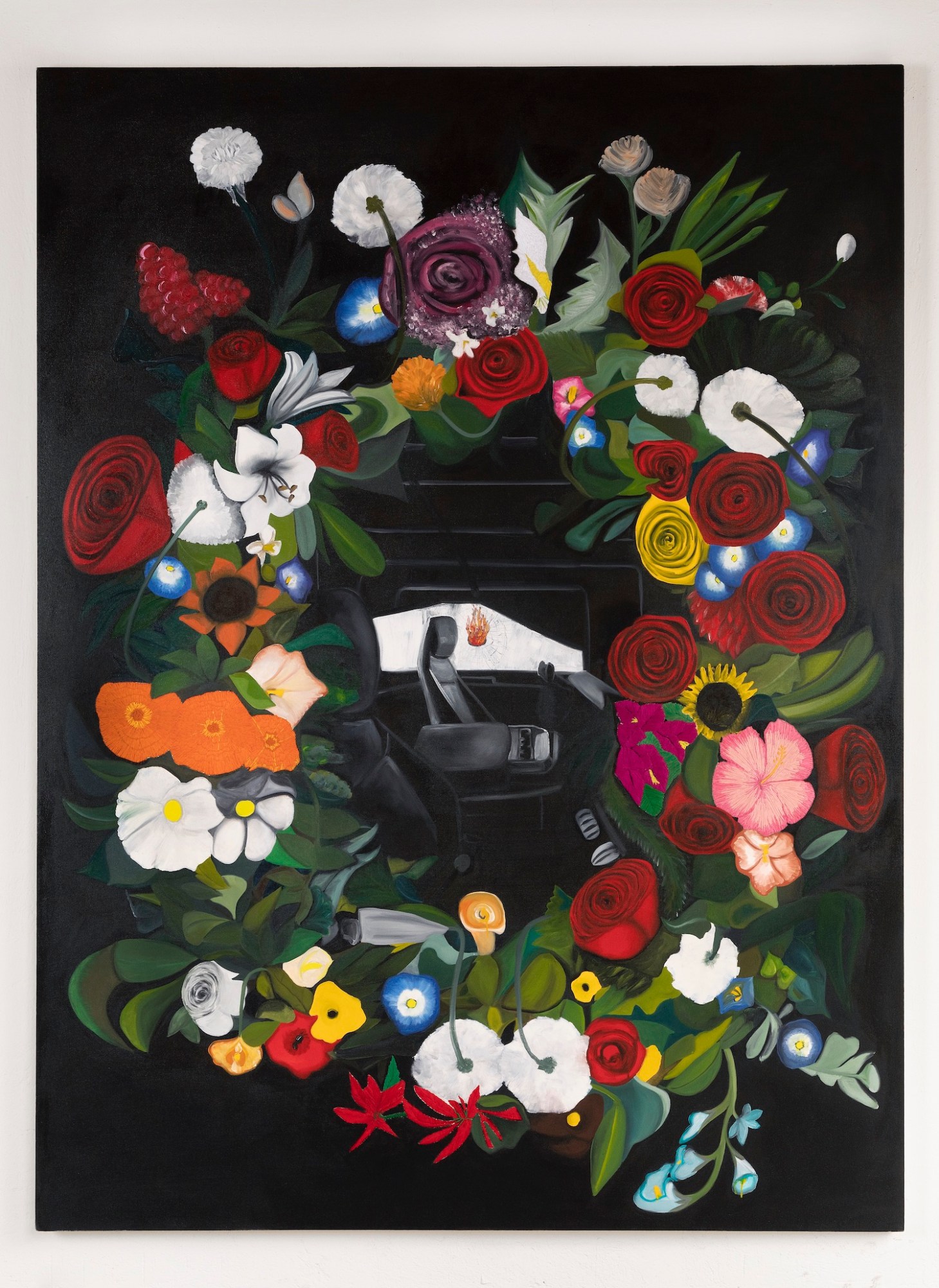 A car seat surrounded by flowers.