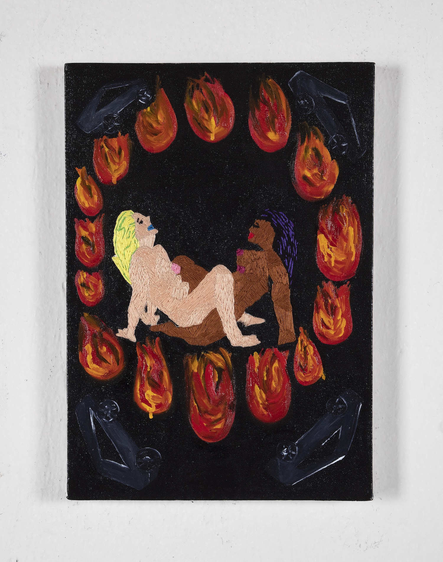 Two femmes having sex in the middle of flames.