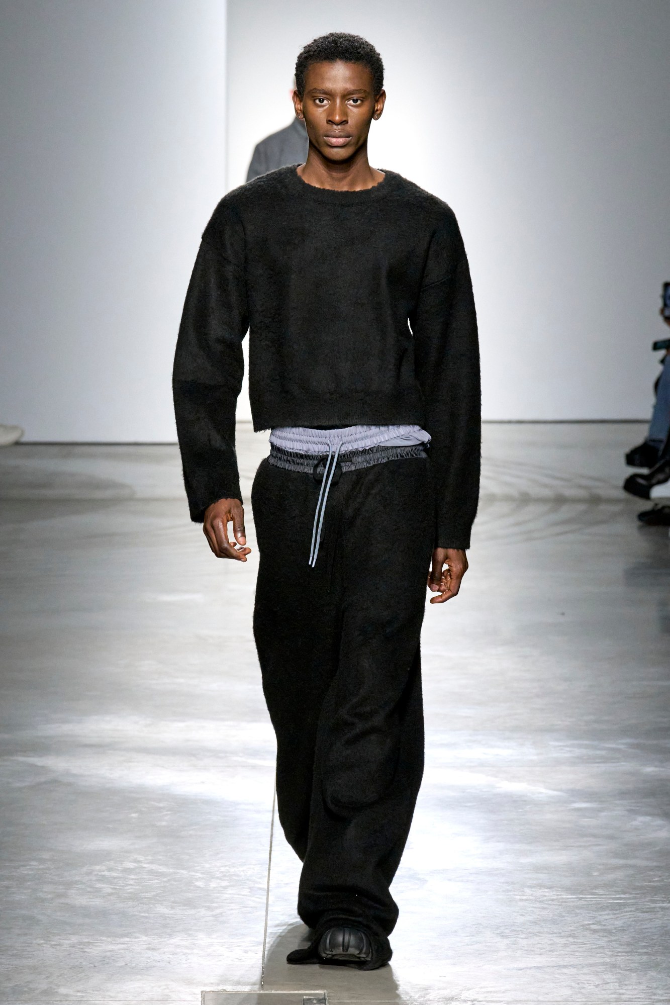 Model walking for Onitsuka Tiger at Milan Fashion Week AW23