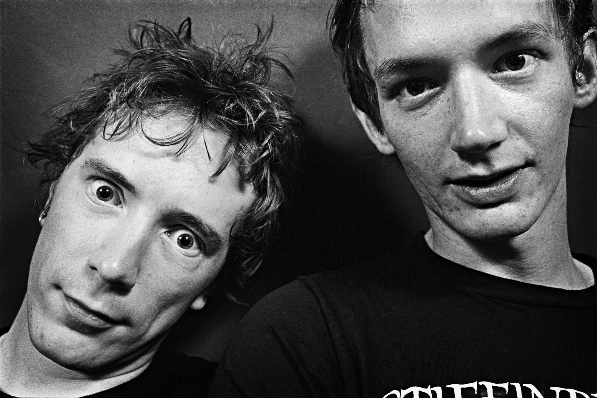 the sex pistols portrait in black-and-white – johnny rotten and another man staring into the camera with messy hair