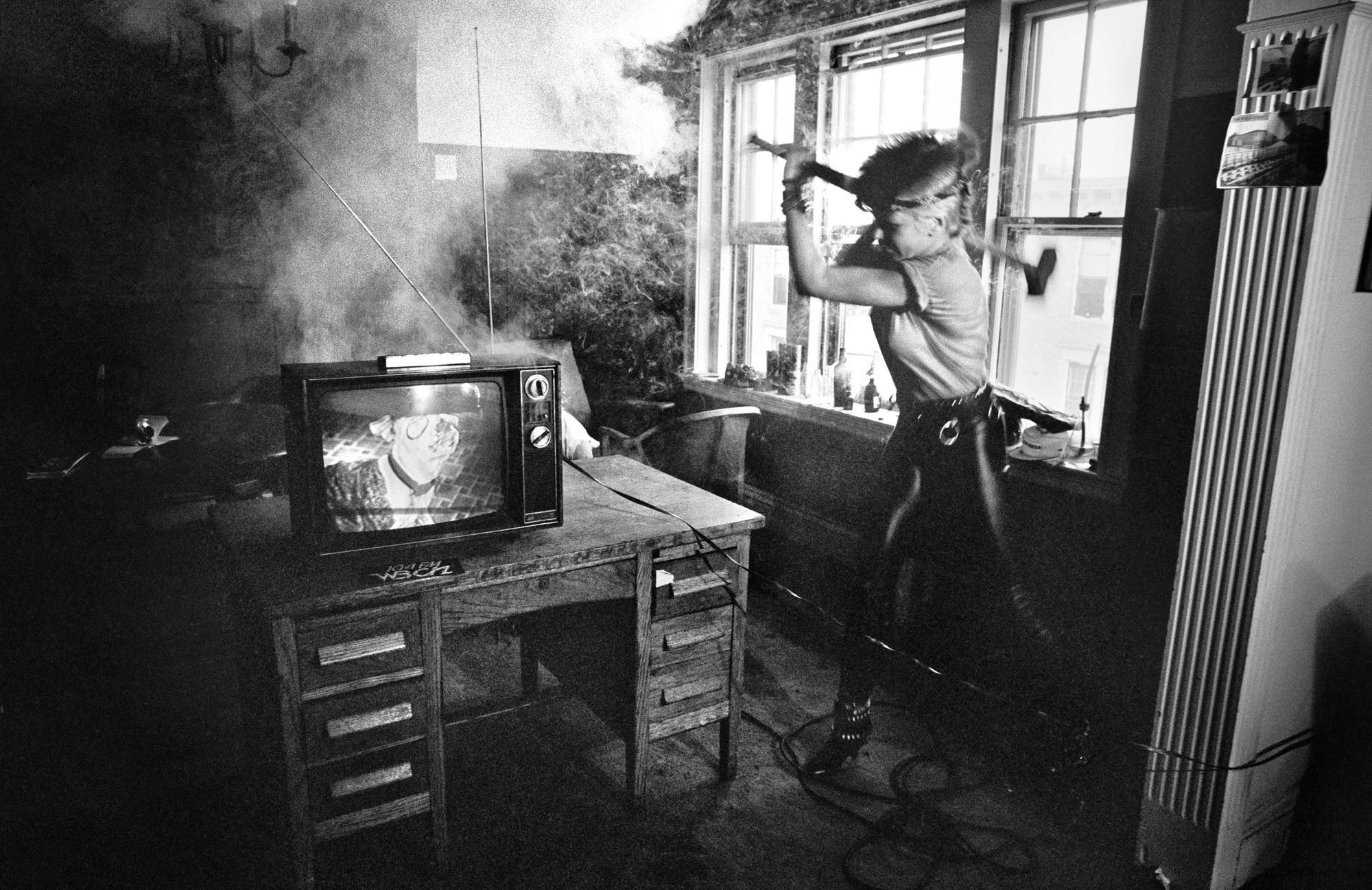 a punk rocker, williams wendy, smashes a smoking television