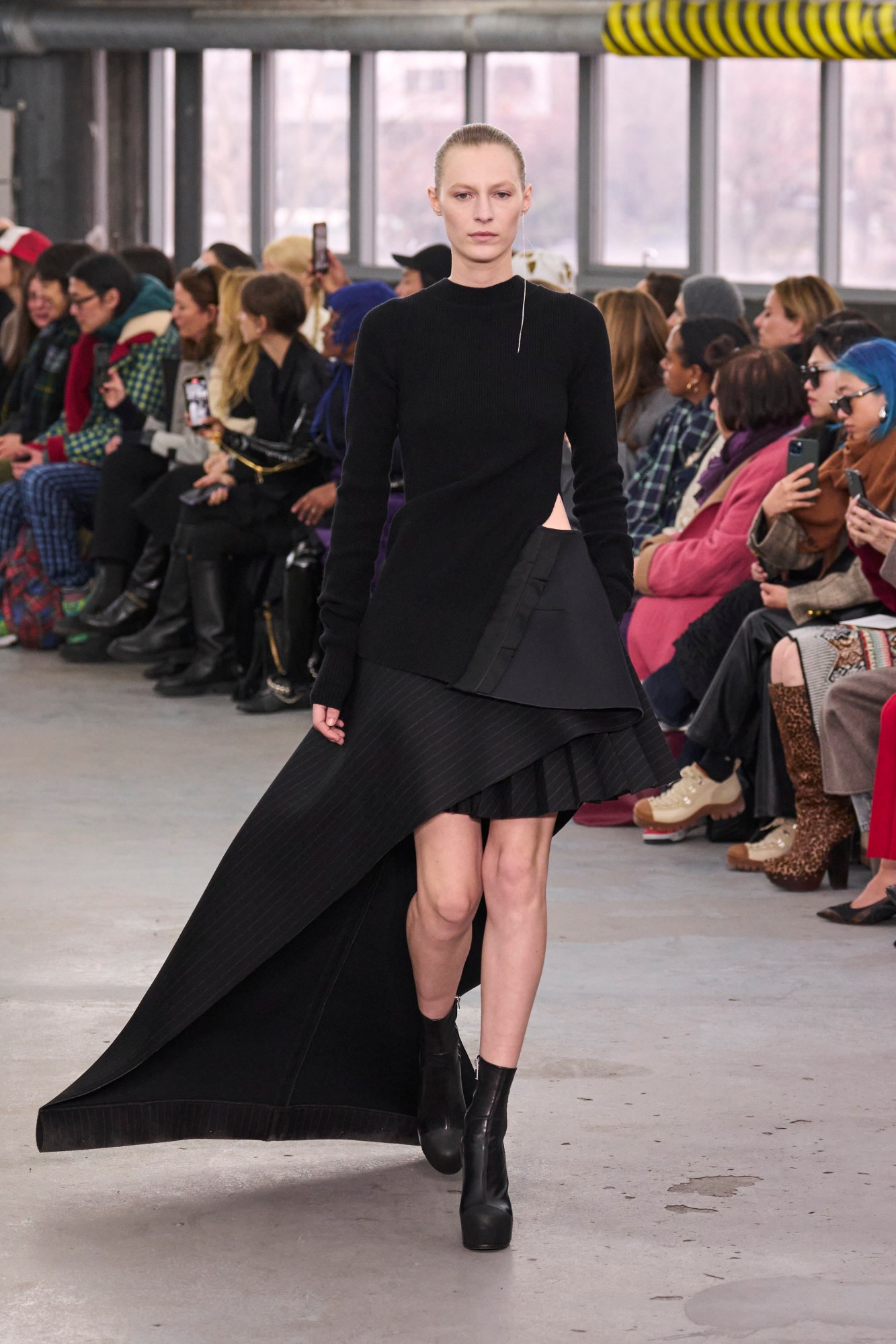 Model walking for the Sacai show at Paris Fashion Week AW23