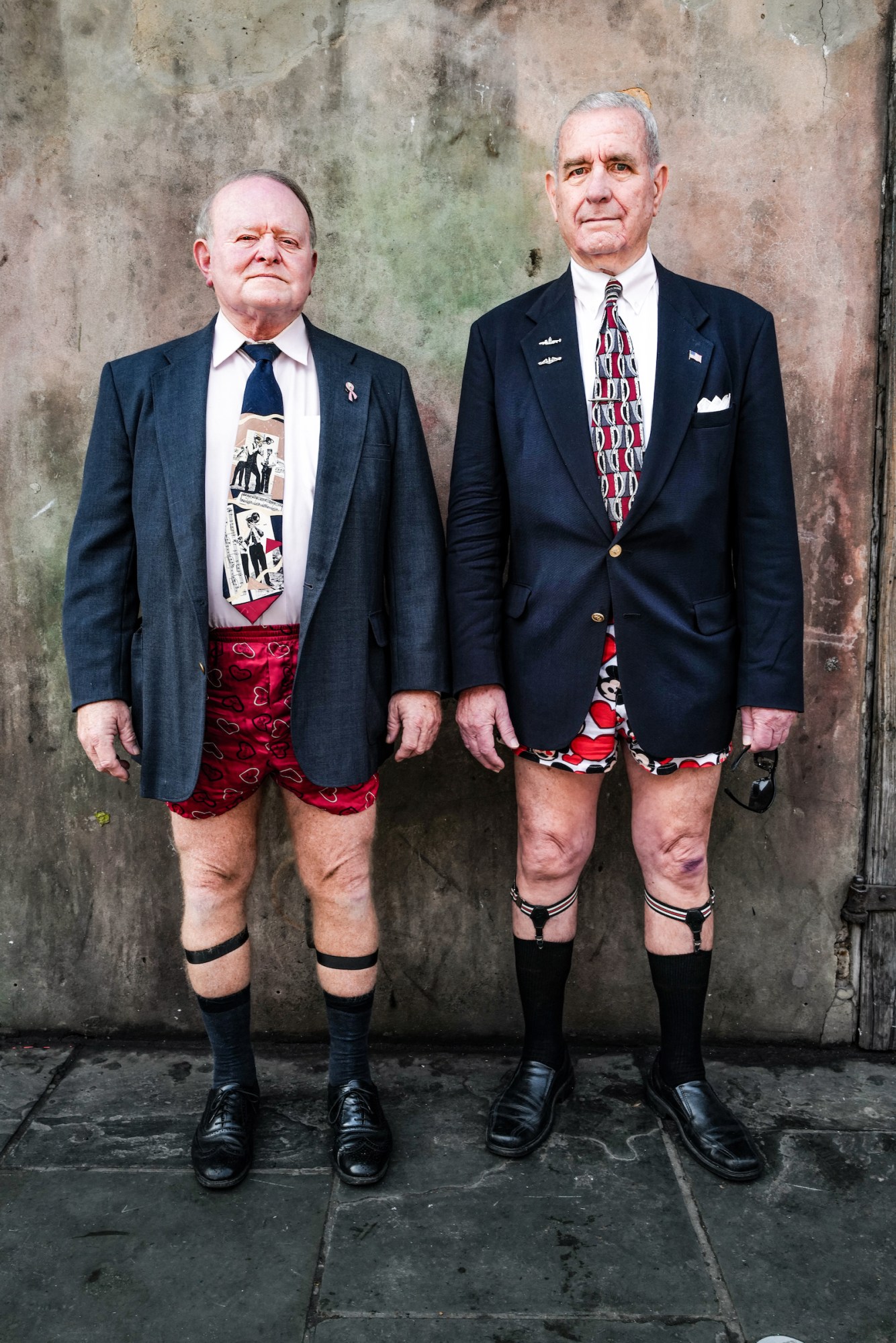 Photograph by Tom TBow Bowden of two men in a couple in suits on their upper body and heart shaped boxer shorts on their lower half