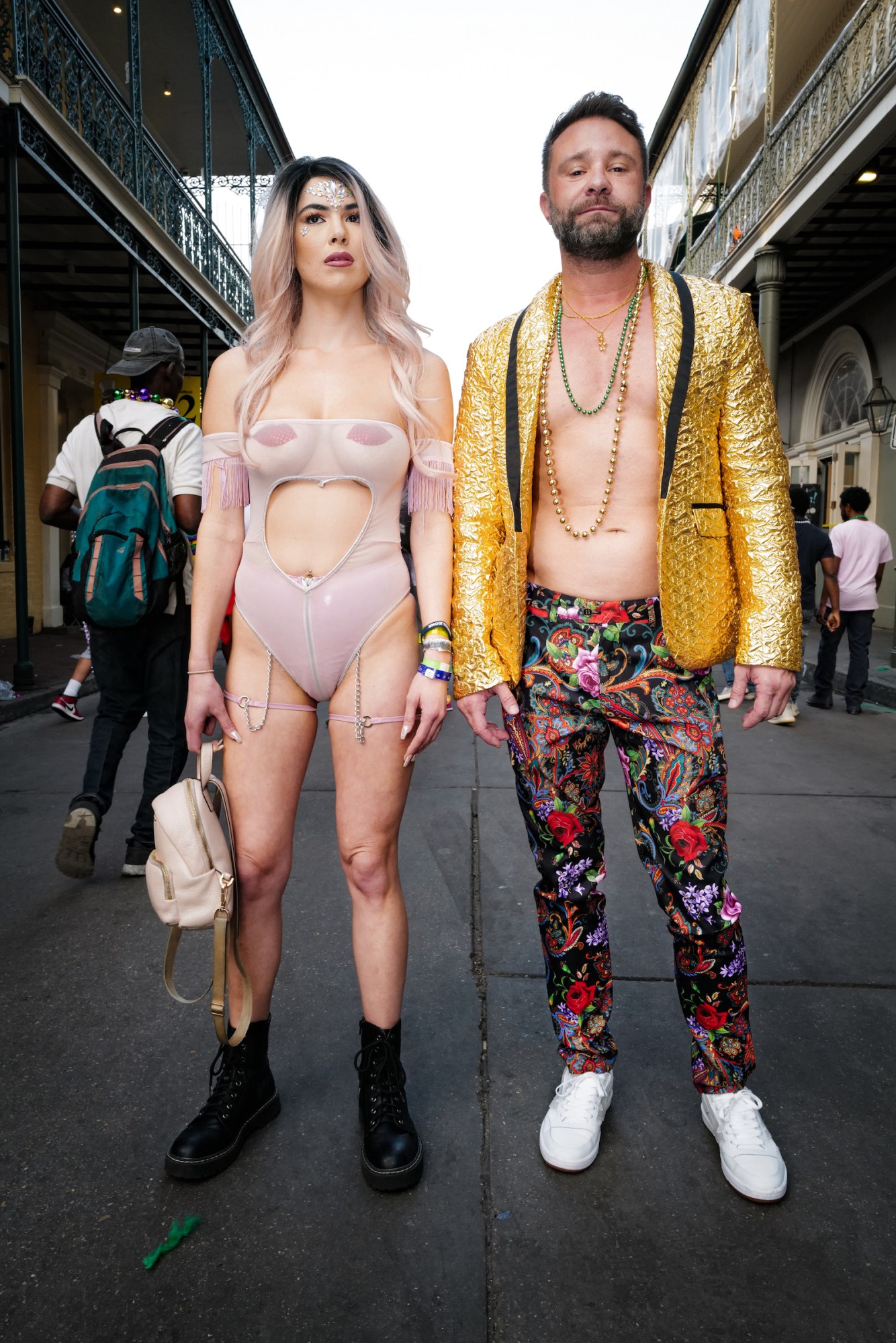 Photograph by Tom TBow Bowden of a couple in festival outfits at Mardi Gras in New Orleans