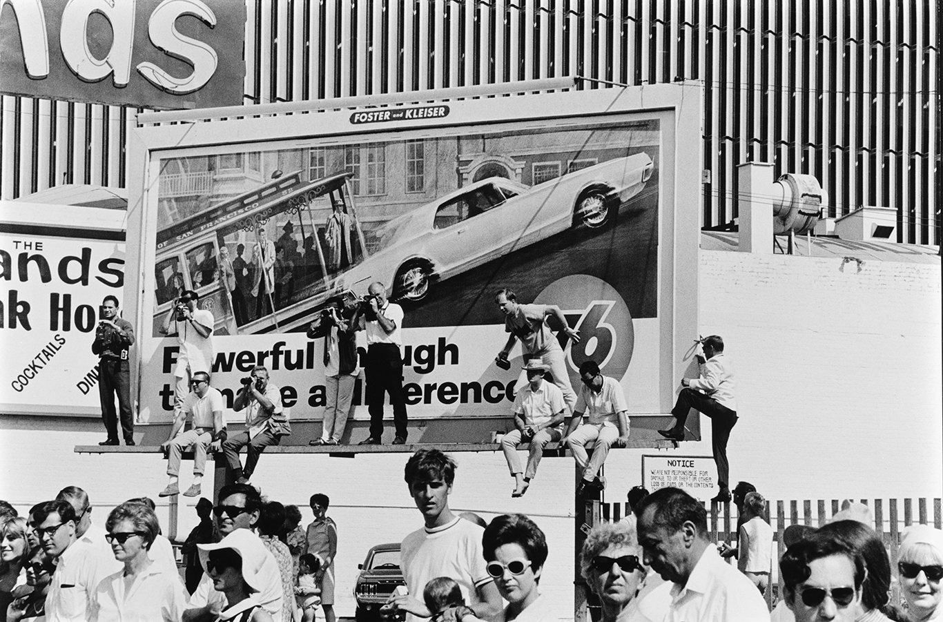 Black-and-white photograph by Steve Schapiro of a Billboard of a car advert in Los Angeles.