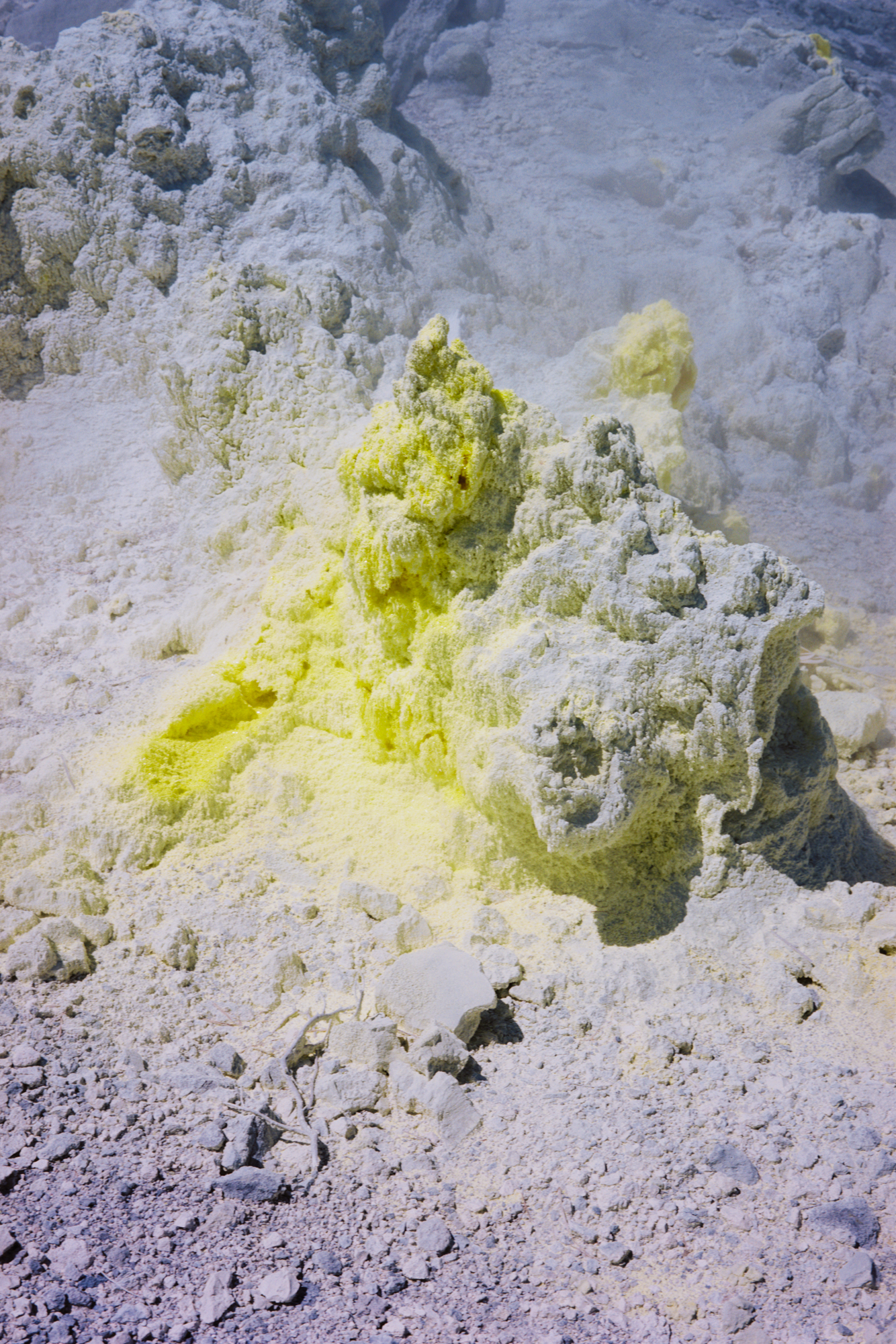 Close up of yellow and blue rocks at a Japanese wild spring