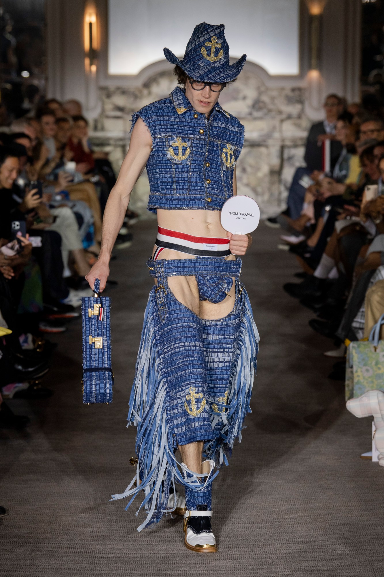 Model wearing a pierced codpiece at the Thom Browne SS23 Mens show