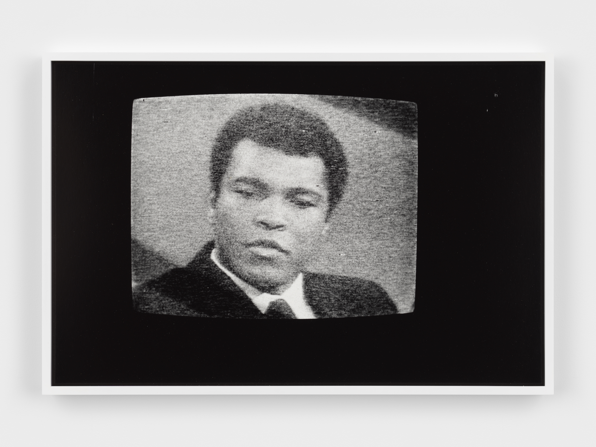 a black and white television displaying muhammad ali