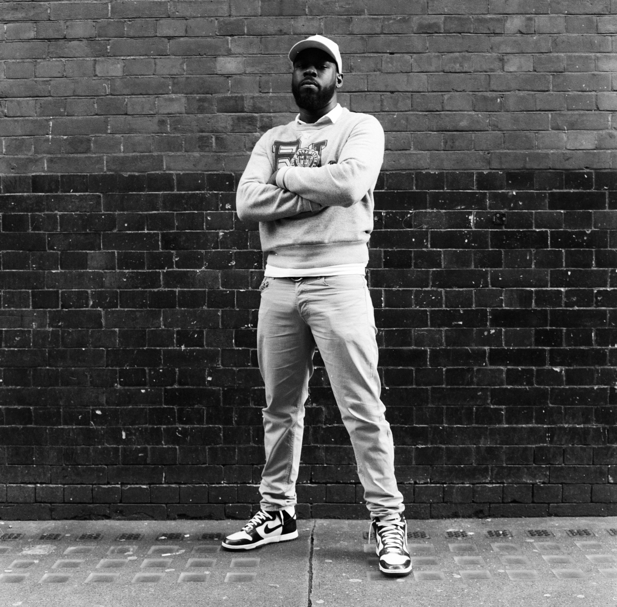 Mark Akintimehin, who plays Onyx in For Black Boys wearing Nie Jordans, denim jeans , a cap, collared shirt and sweatshirt.