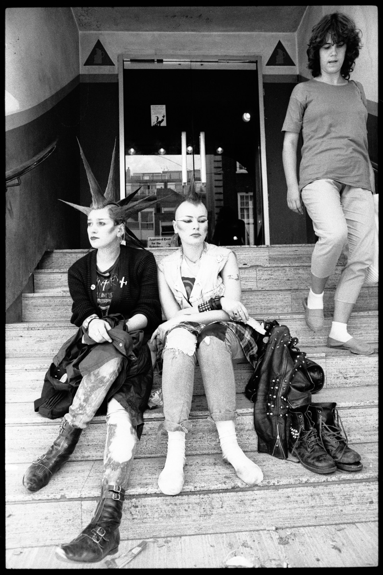 punks sitting on the steps at kings road london 1983