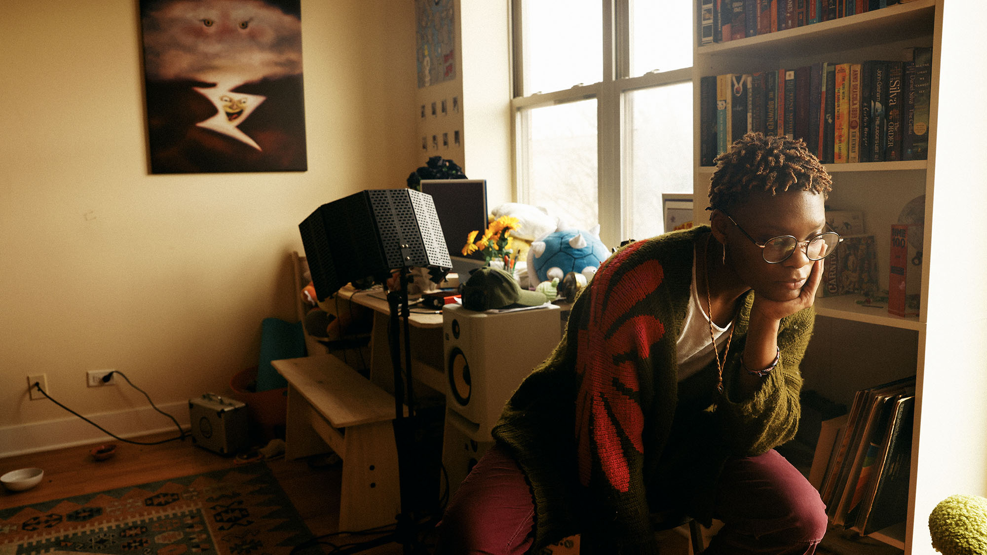 dreamer looking pensive sitting in the corner of their home studio