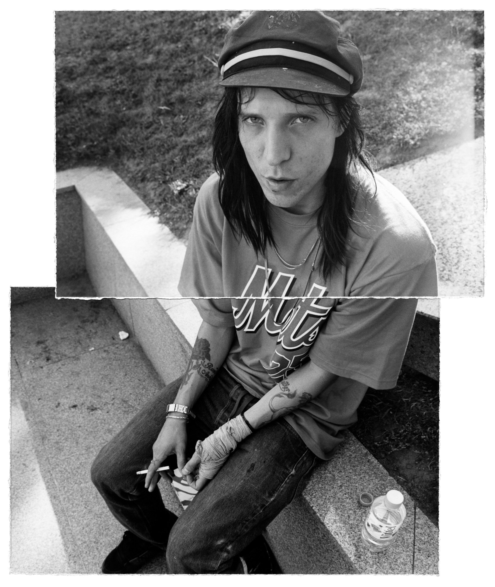 a skater wearing a newsboy cap wearing baggy clothes and smoking a cigarette