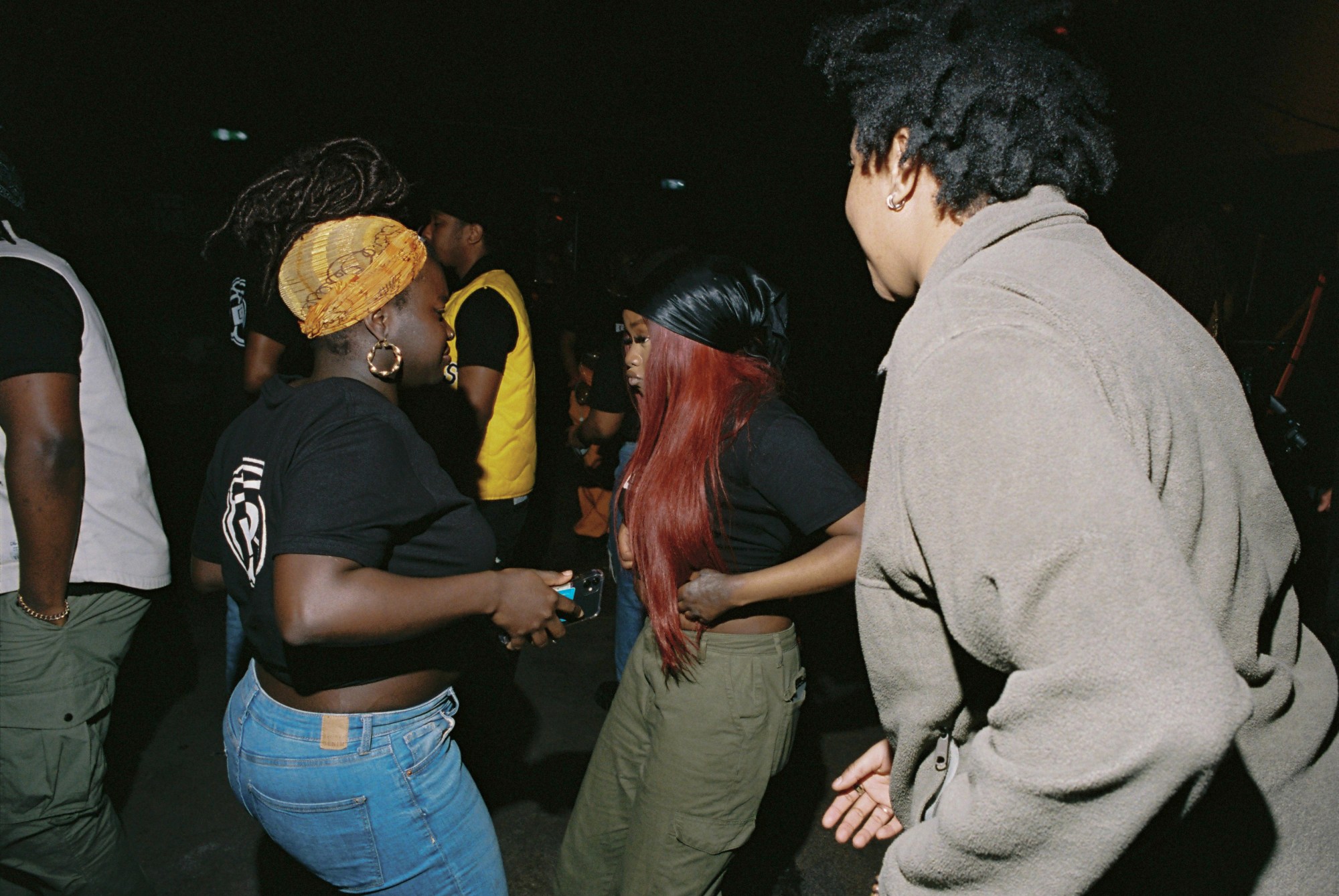 crowd of people dancing at da community event in london