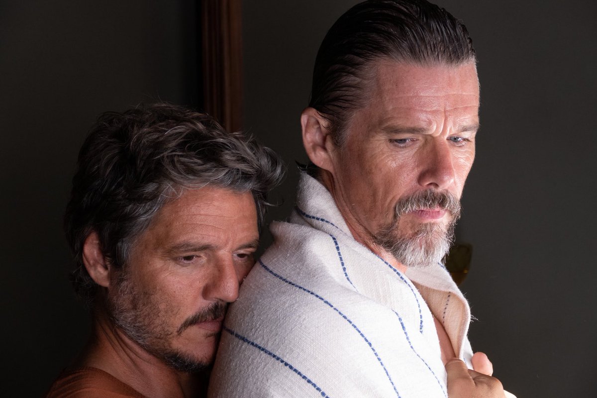 pedro pascal hugs ethan hawke from behind in strange way of life