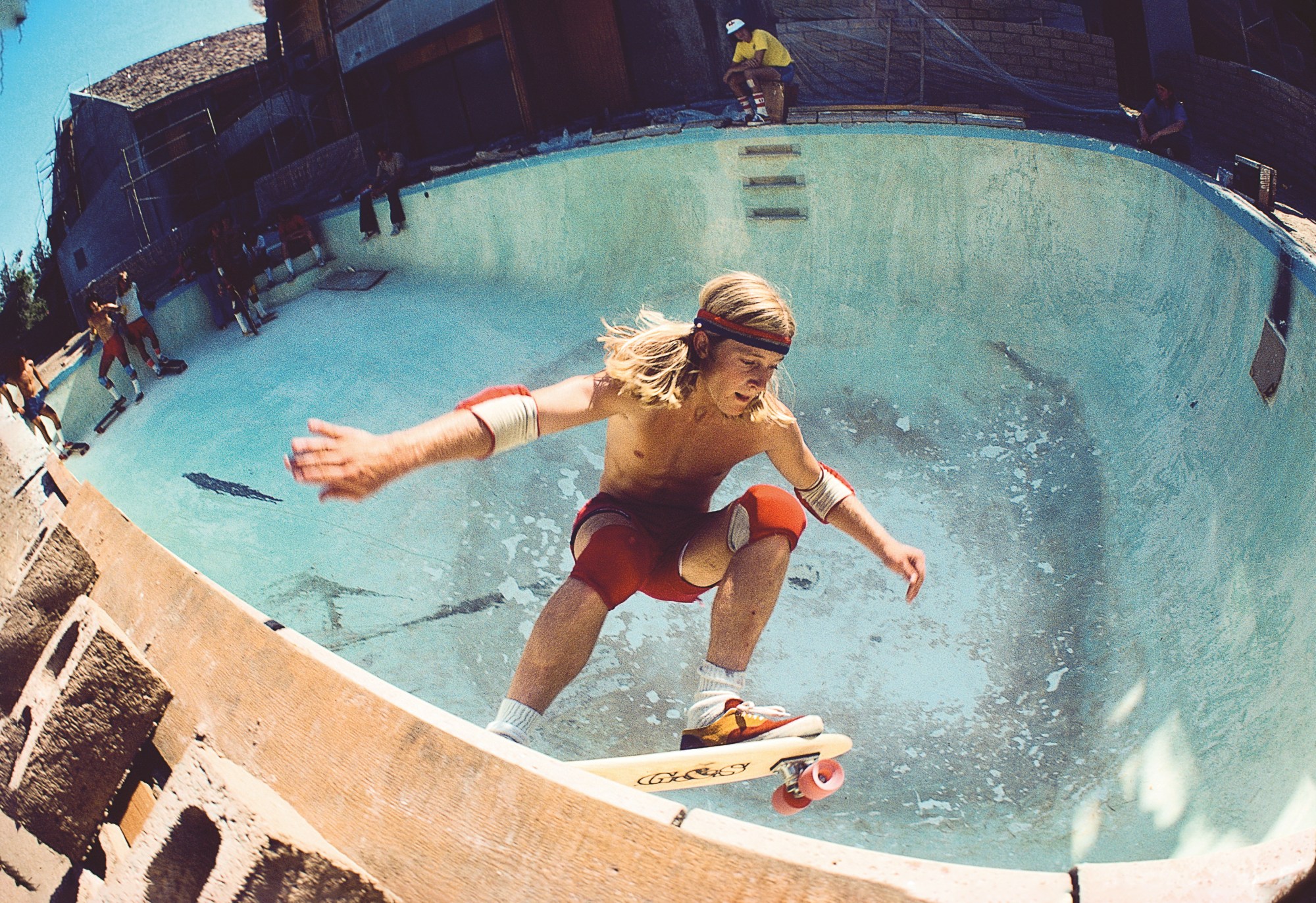 a blonde haired kid skating a swimming pool in hugh holland's book Locals Only: California Skateboarding 1975-1978