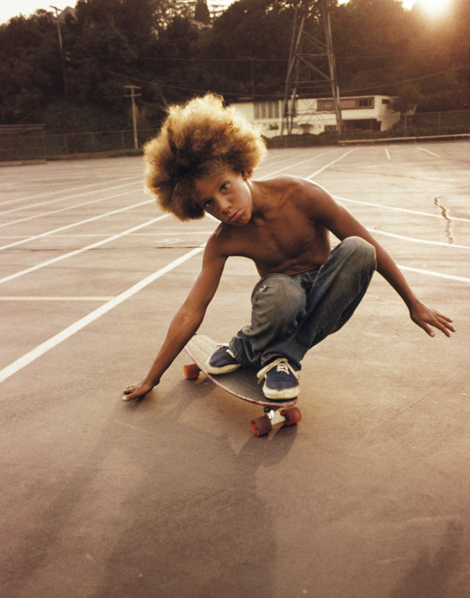 a kid with an afro skateboarding in hugh holland's new book Locals Only: California Skateboarding 1975-1978