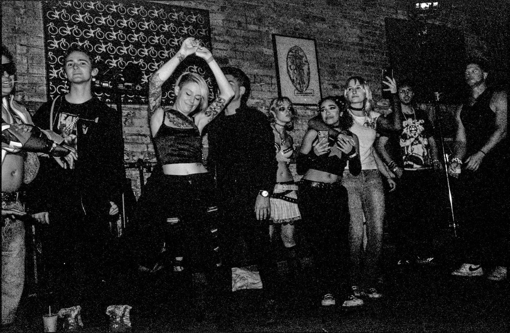 black and white photo of ravers dancing at a happy hardcore event in toronto