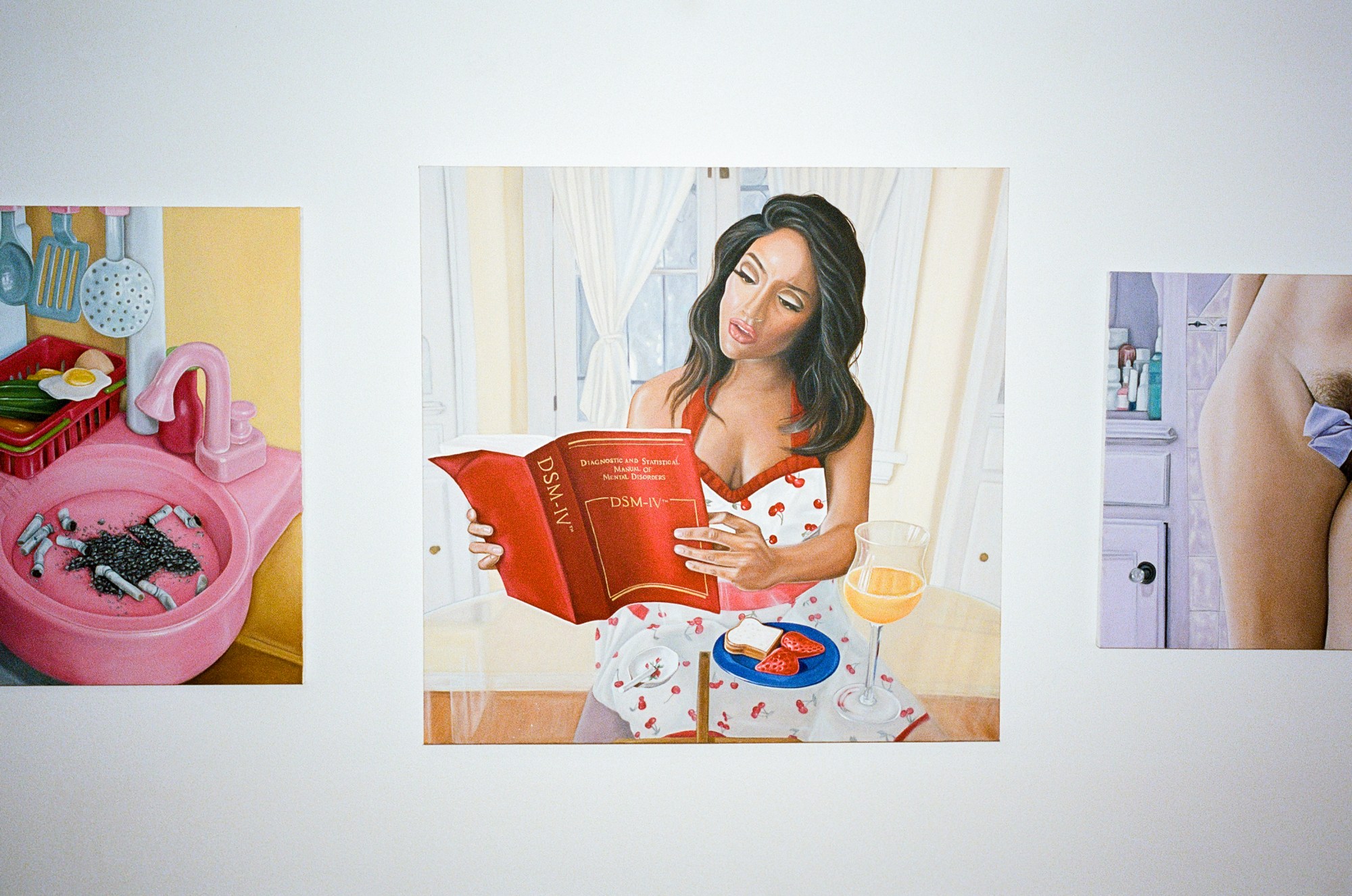 left to right; a painting of a pink sink filled with cigarette butts; a painting of a woman wearing a red and white apron reading a red book; a painting of a woman's pubic hair covered with a purple bow