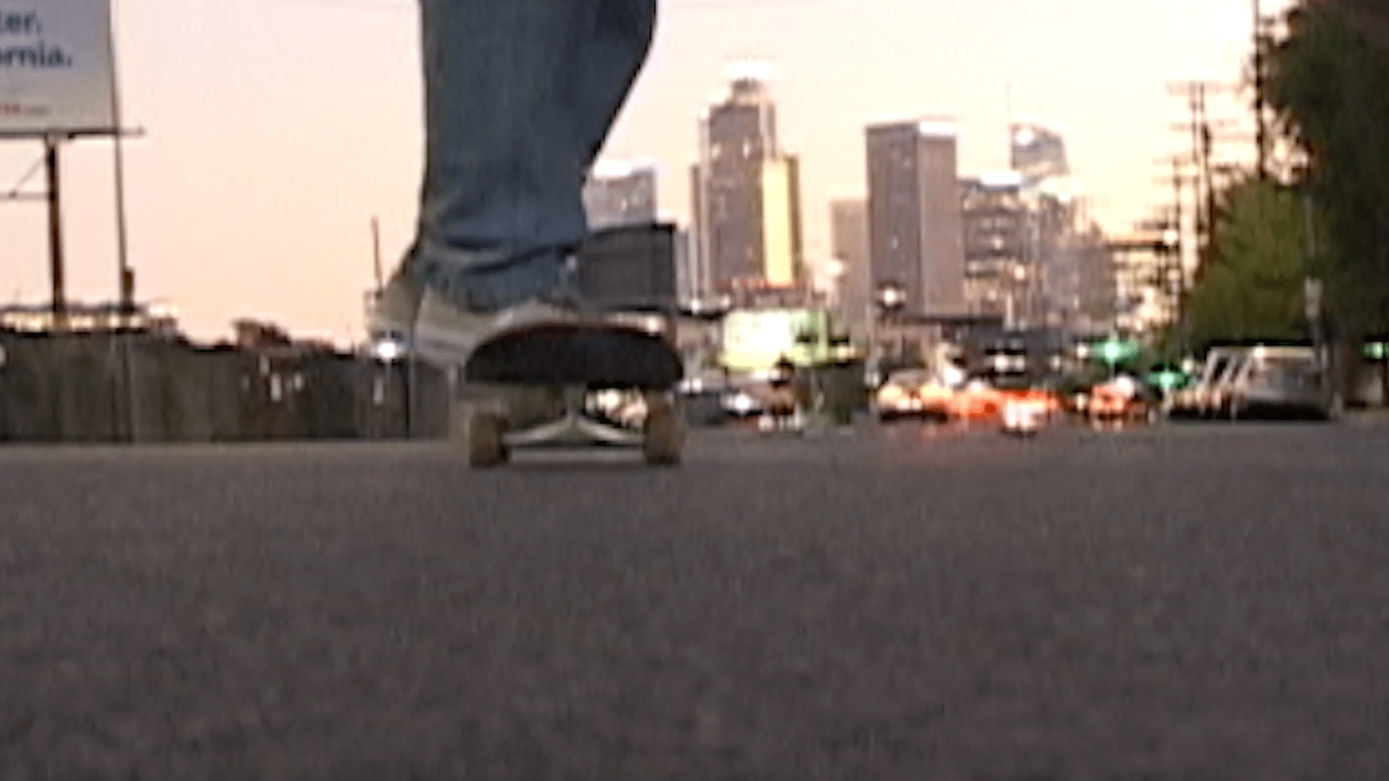 a blurry image of a person's legs as they skateboard through LA