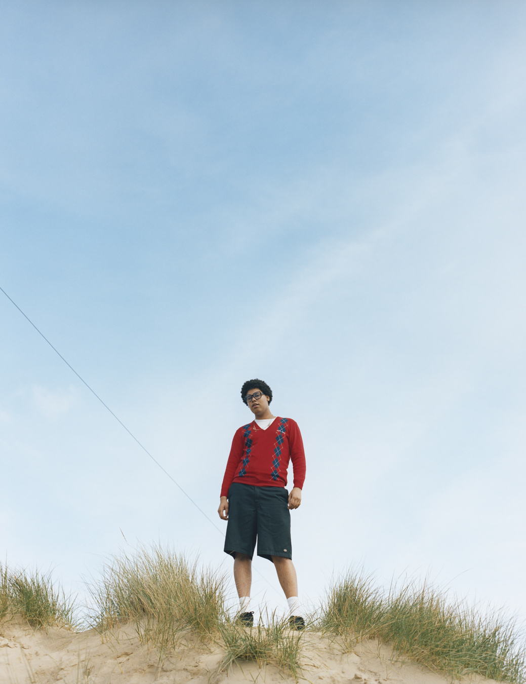 Musician Sekou photographed by Oliver Hadlee Pearch on Camber Sands.