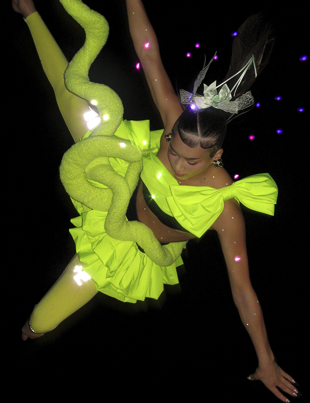 Gymnast Georgia photographed mid-leap by Harley Weir with make-up by Thomas De Kluyver.