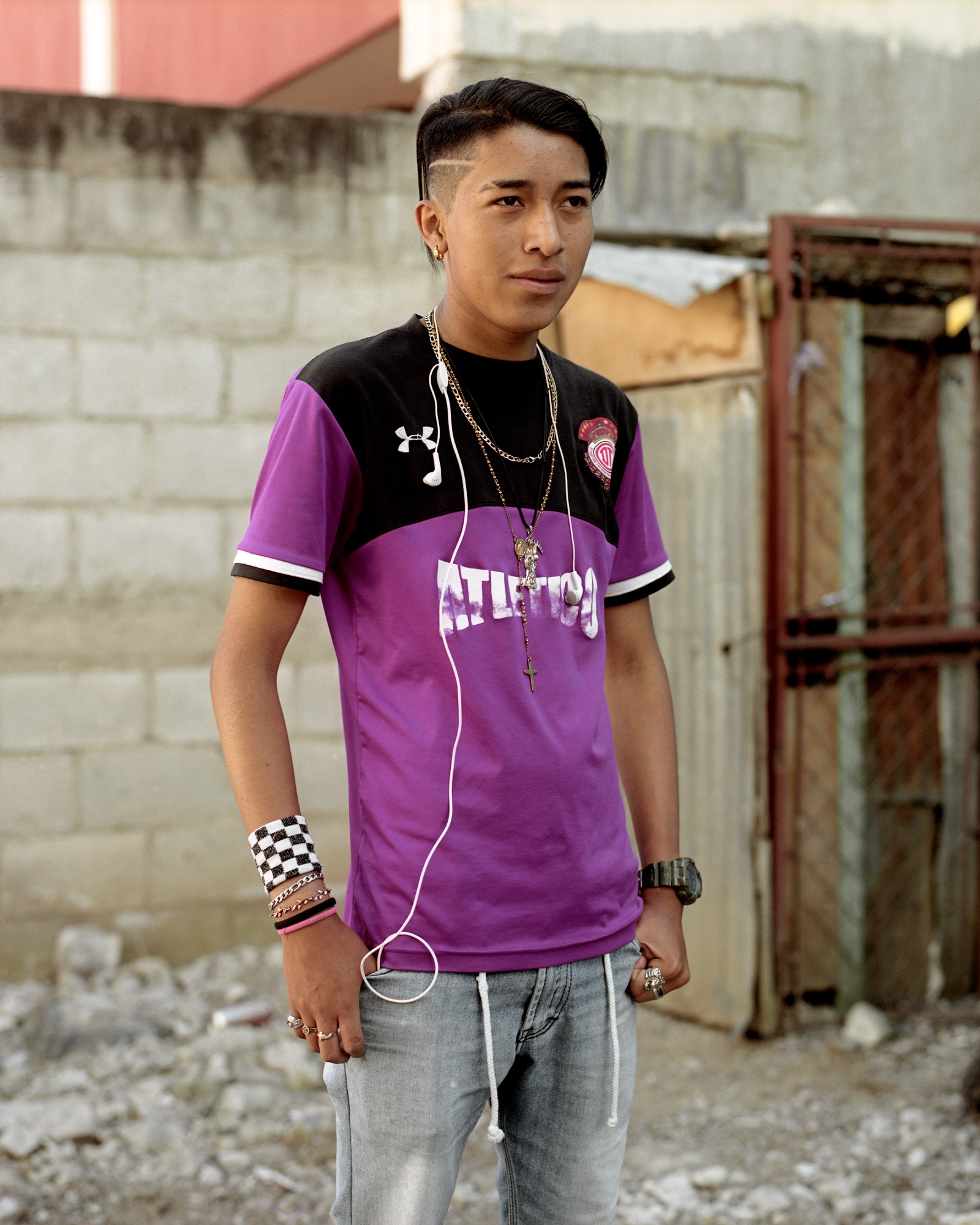 guatemalan teen in a purple sports jersey wearing silver jewelry