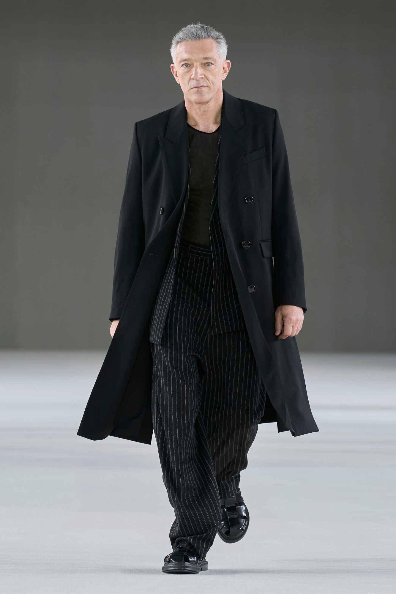 Model walking at the Ami show at Paris Fashion Week Men's SS24