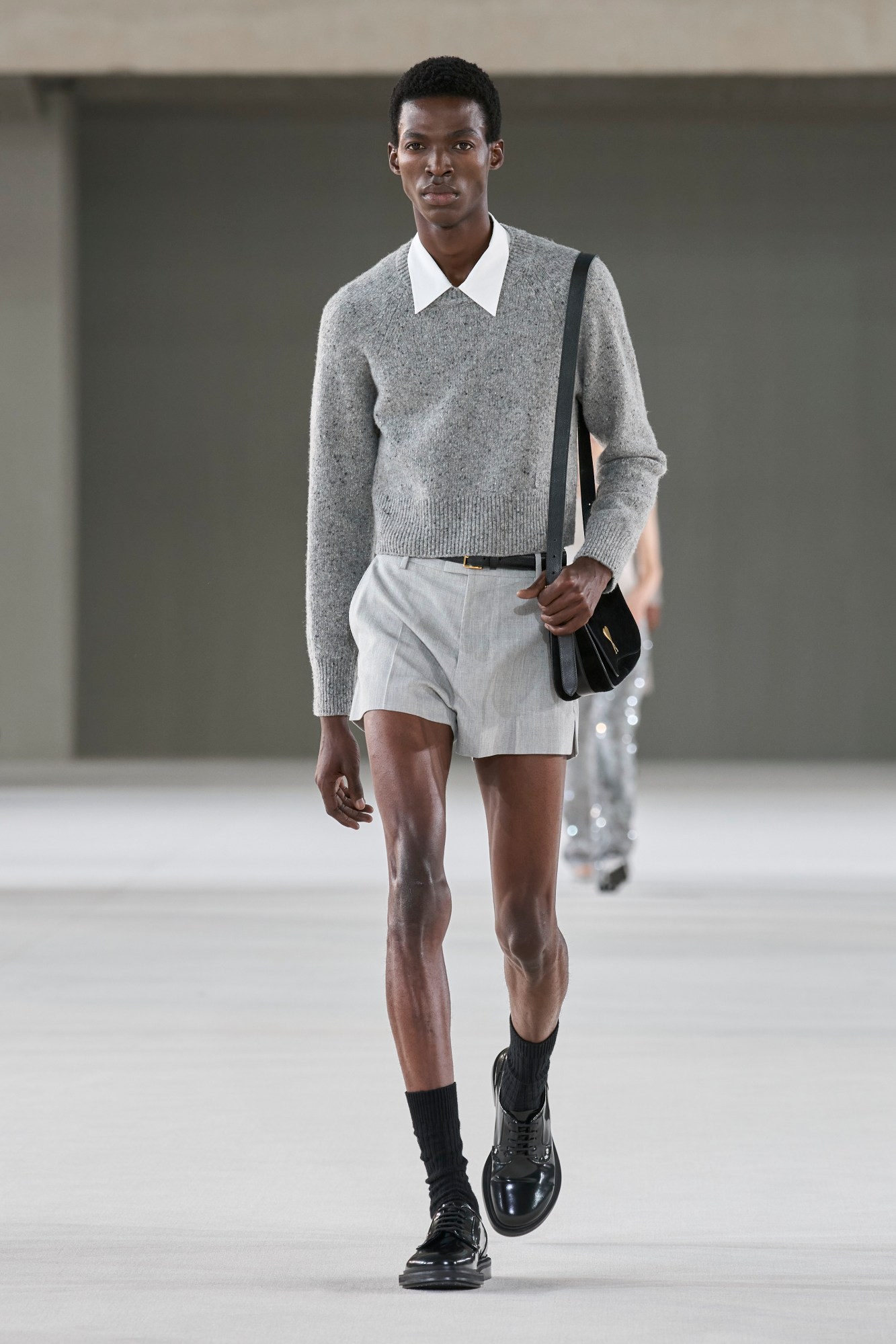 Model walking at the Ami show at Paris Fashion Week Men's SS24