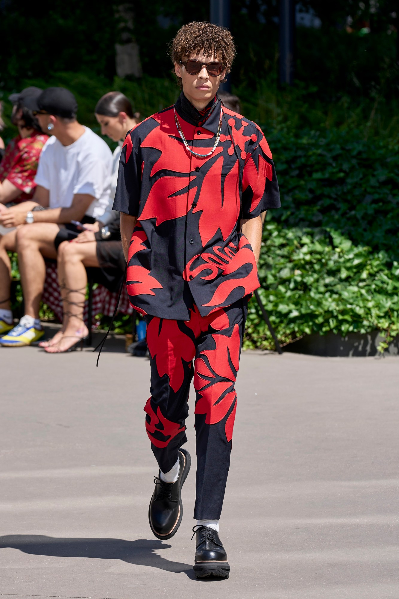 Model walking for Sacai at Paris Fashion Week Men's SS24