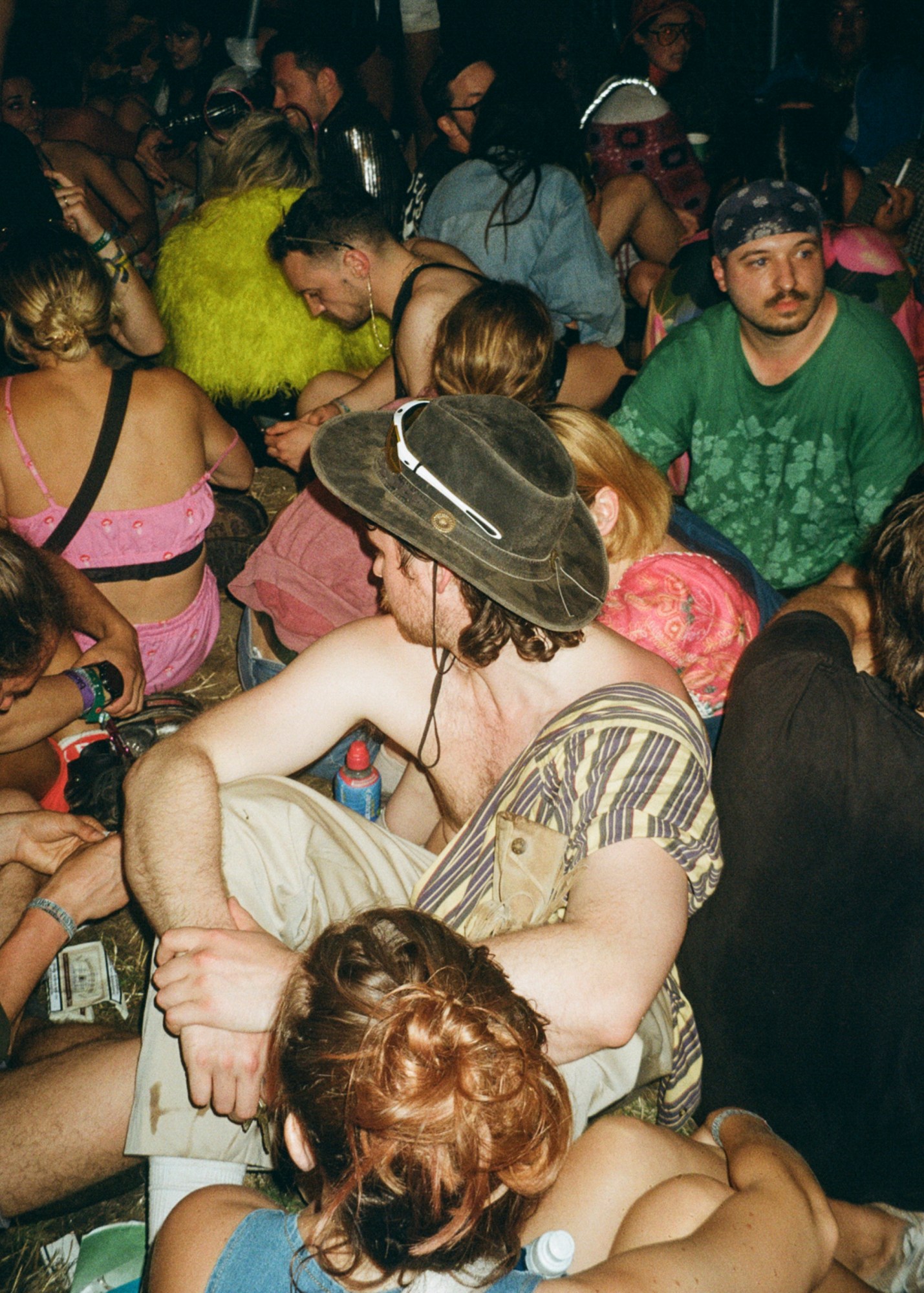 club goers sitting on the ground at nyc downlow