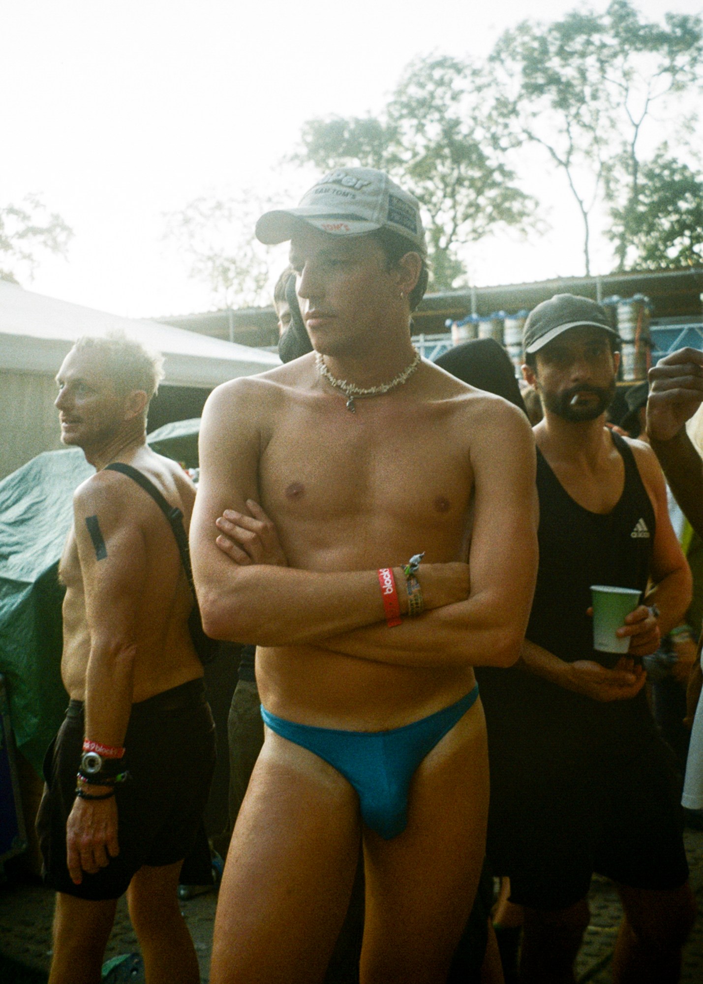 a man in a hat and blue speedo