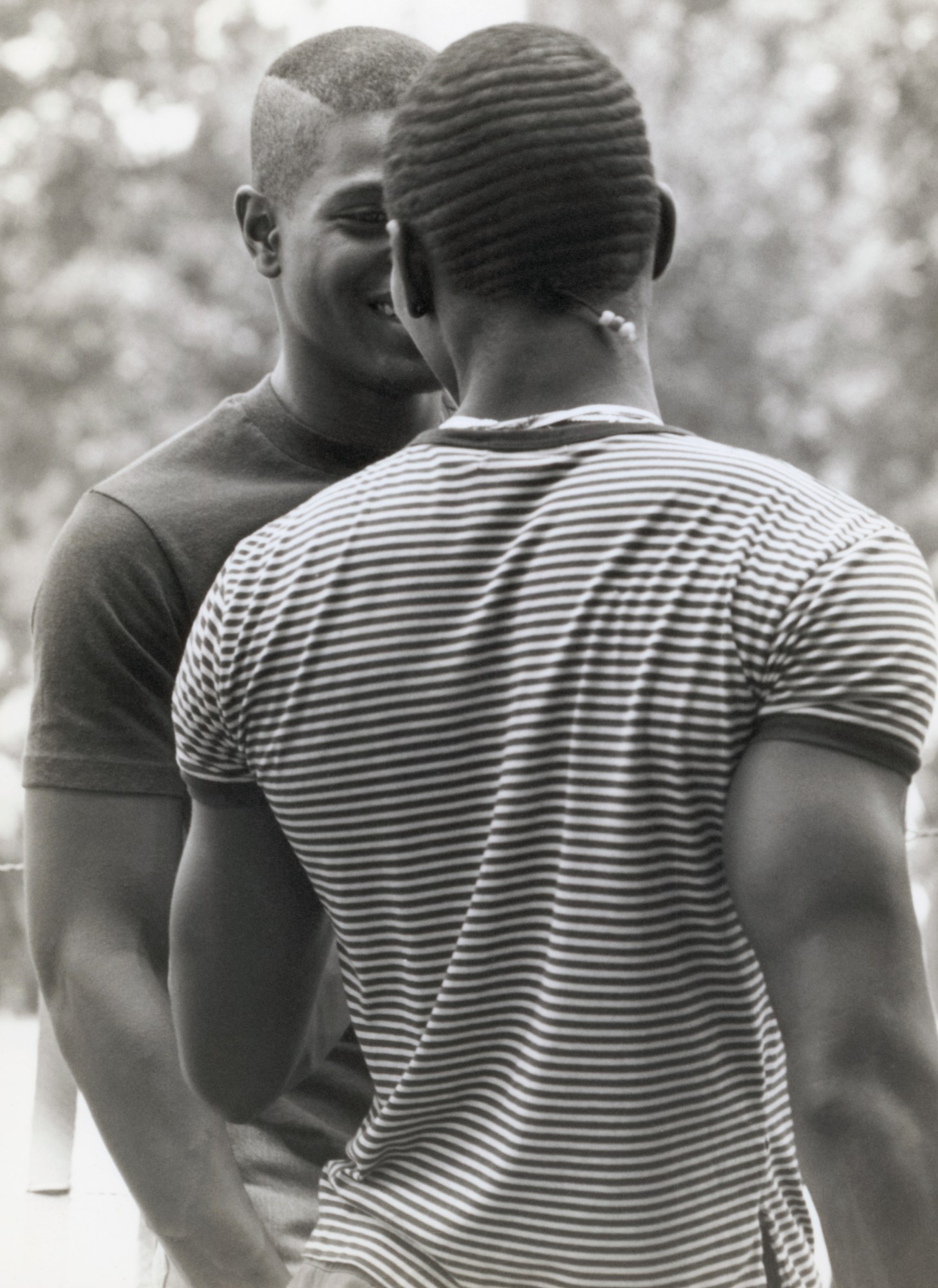 two young men chatting in t shirts