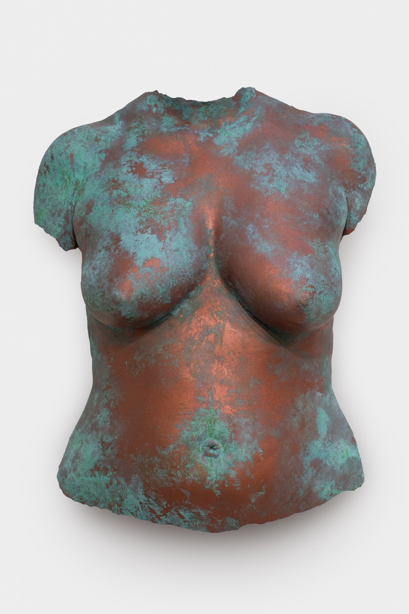 a copper molding of a woman's body