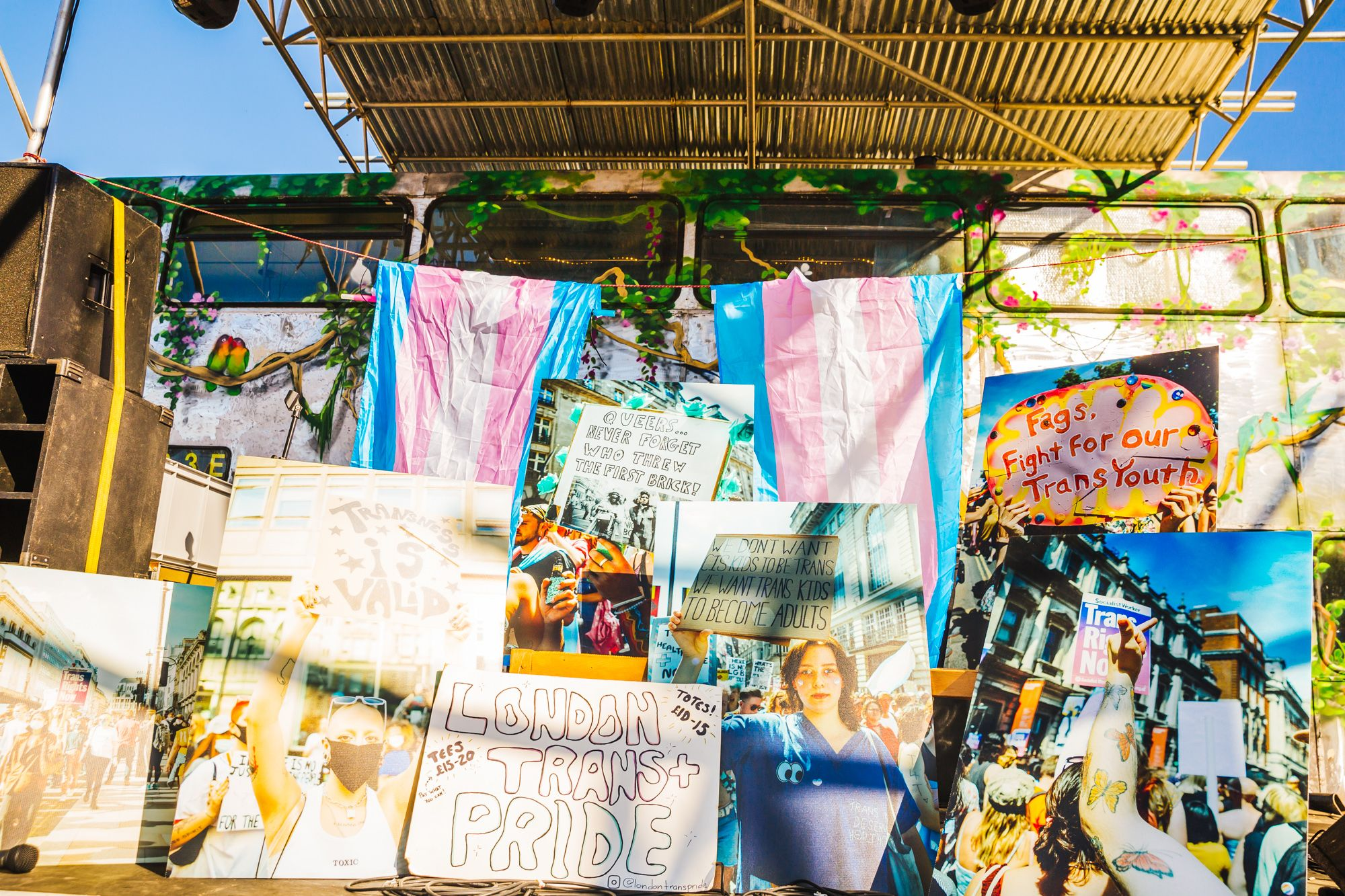 Trans Pride flags and signs at Glastonbury