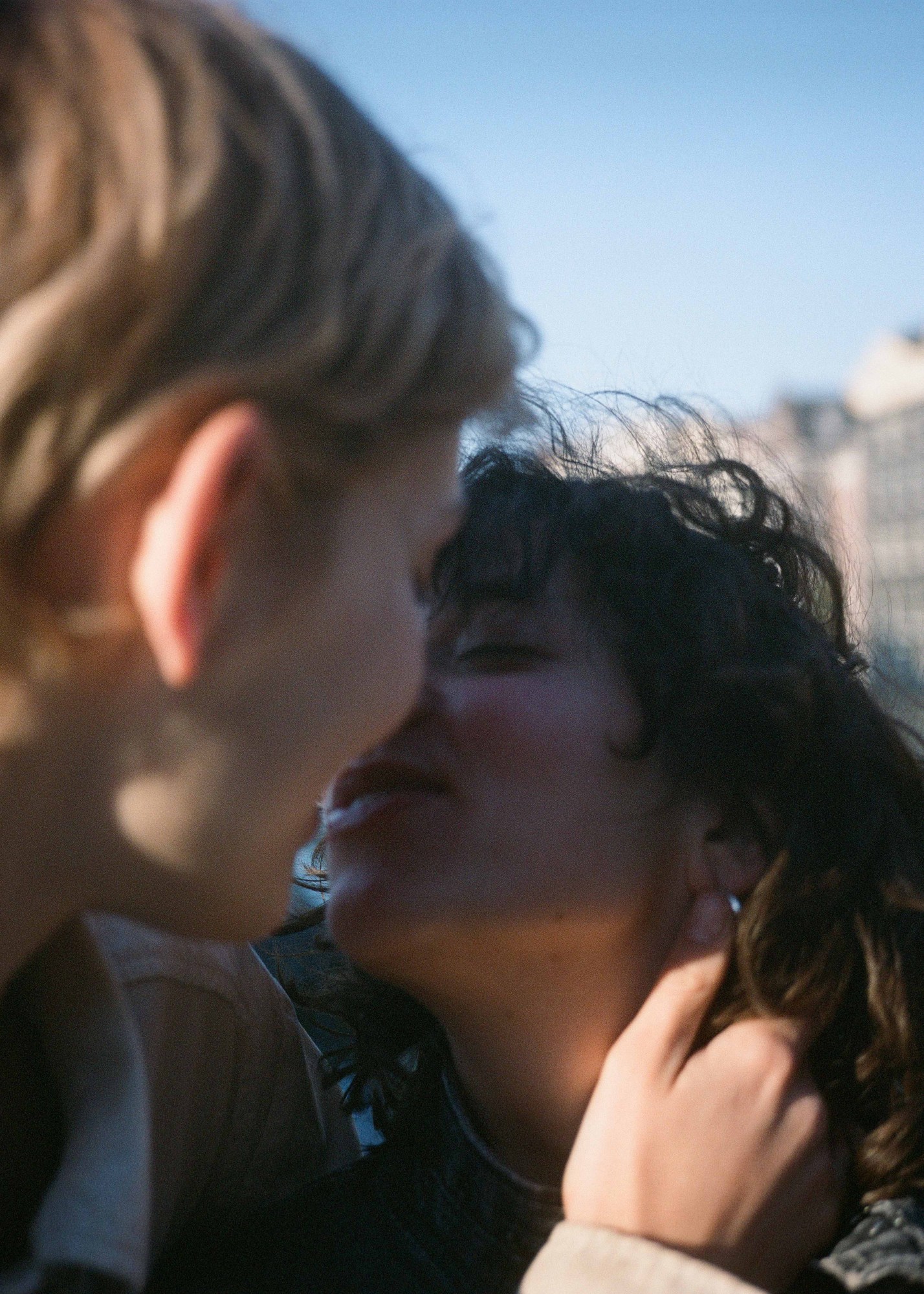 blurry image of two people about to kiss