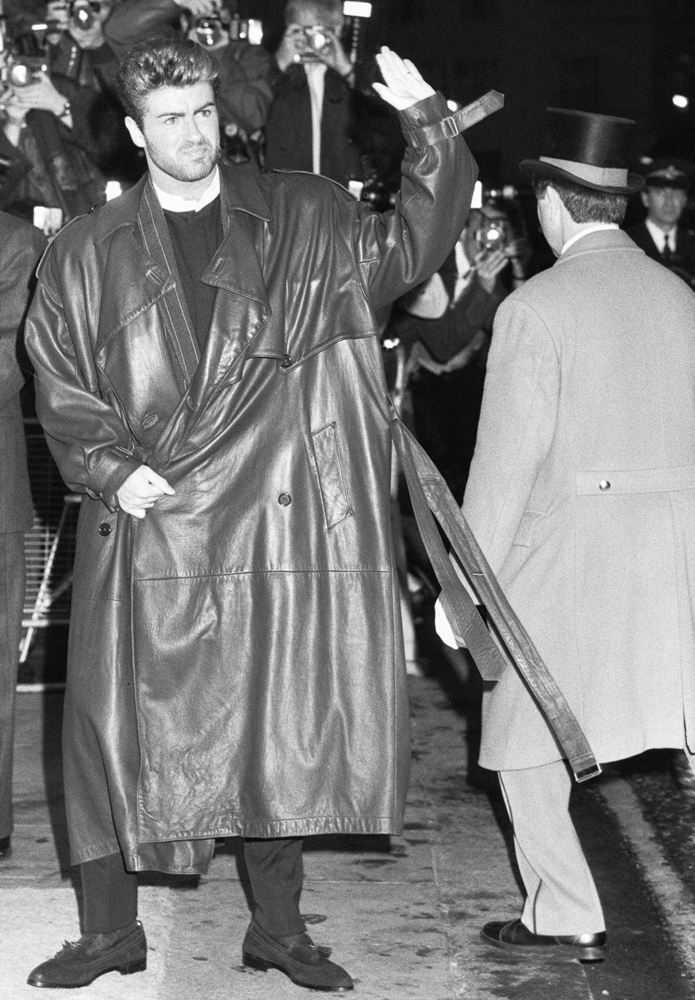 george michael in a massively oversized leather trench coat in the 80s