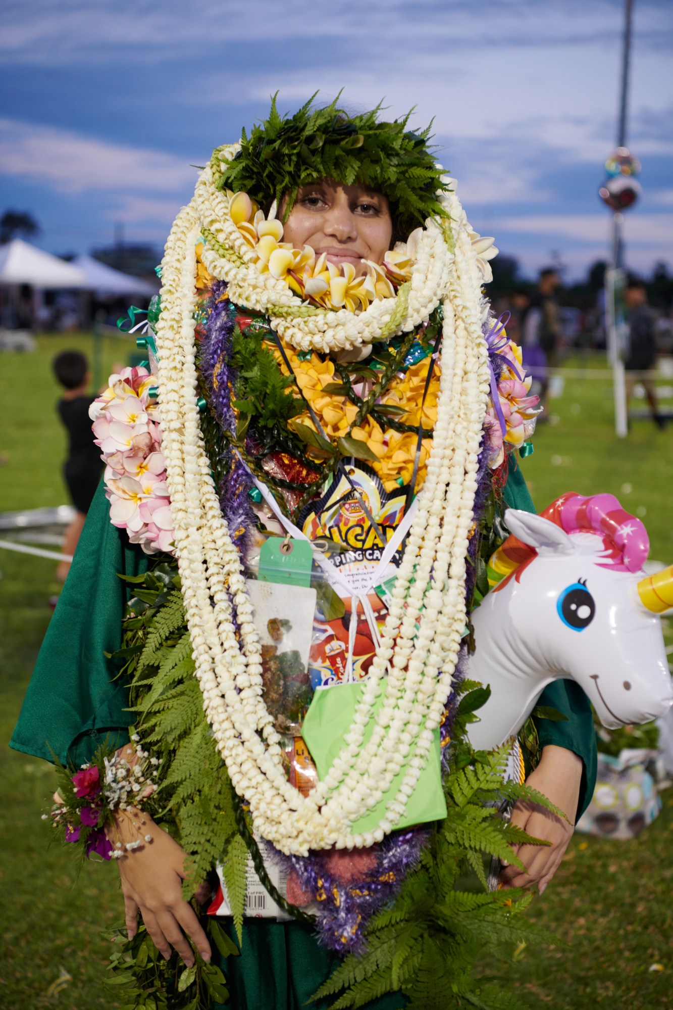 mikaila covered in floral hawaiian lei's at Kapaʻa High School graduation