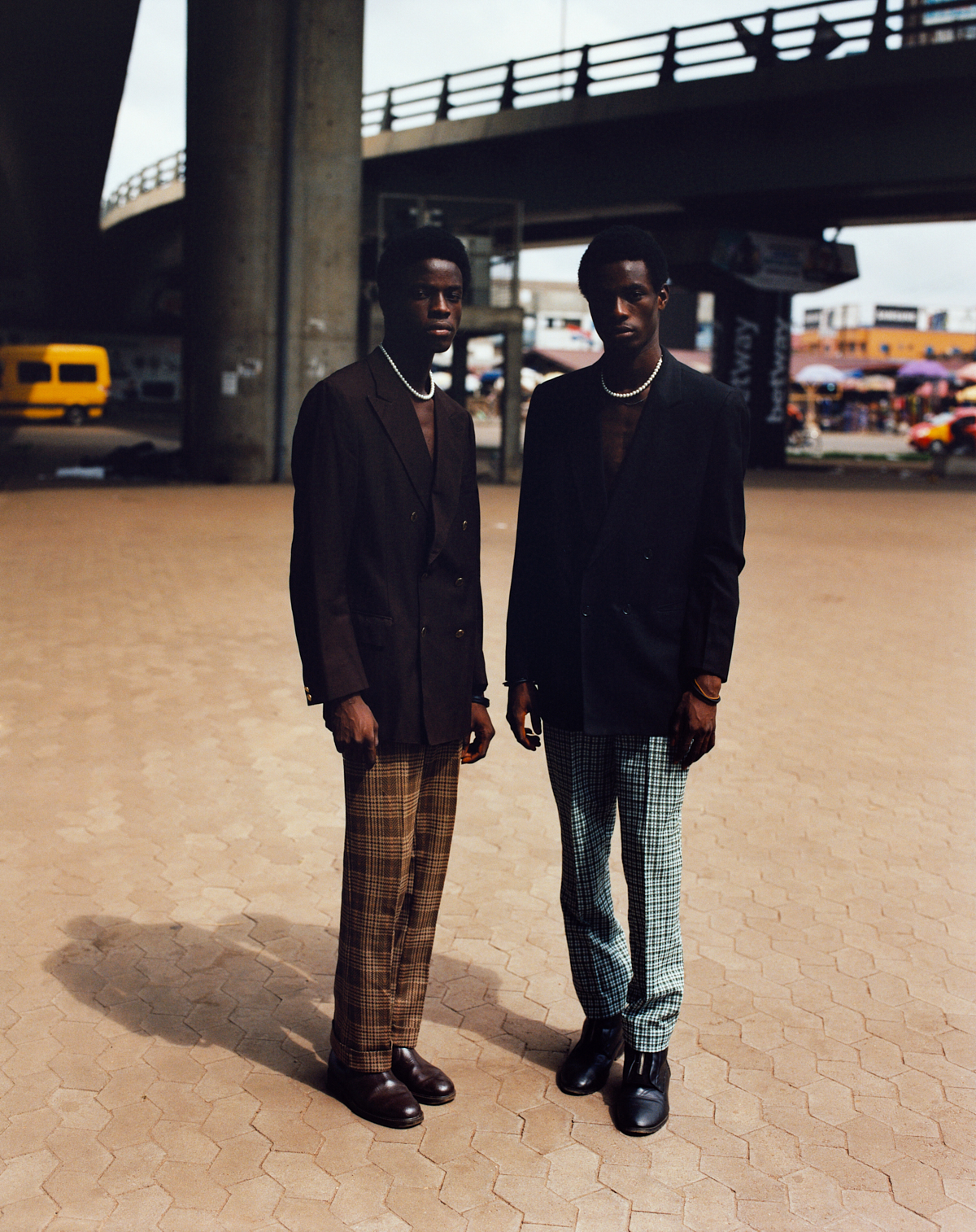 two ghanian guys in plaid pants and blazers photographed by kyle weeks