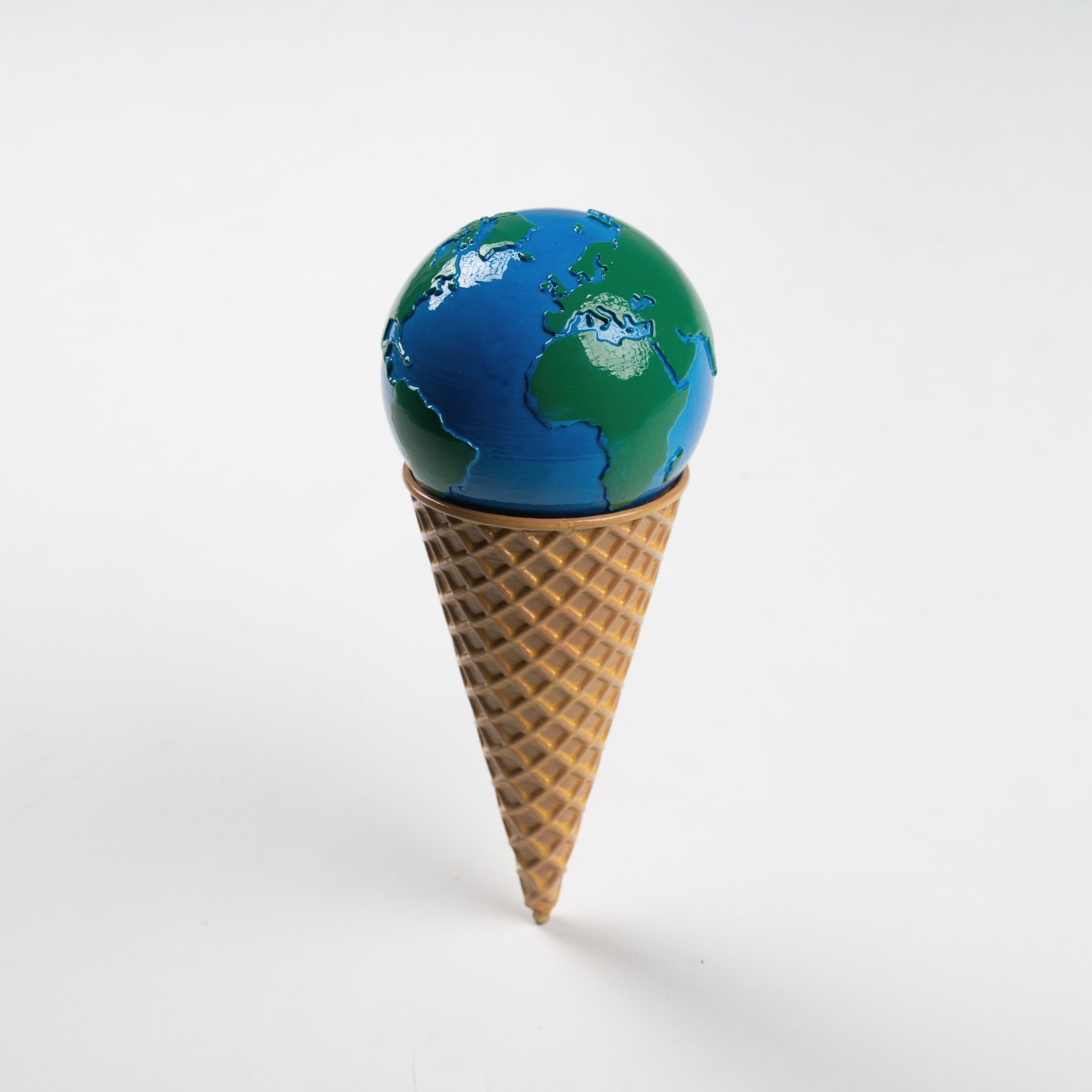 a model of earth in a waffle cone