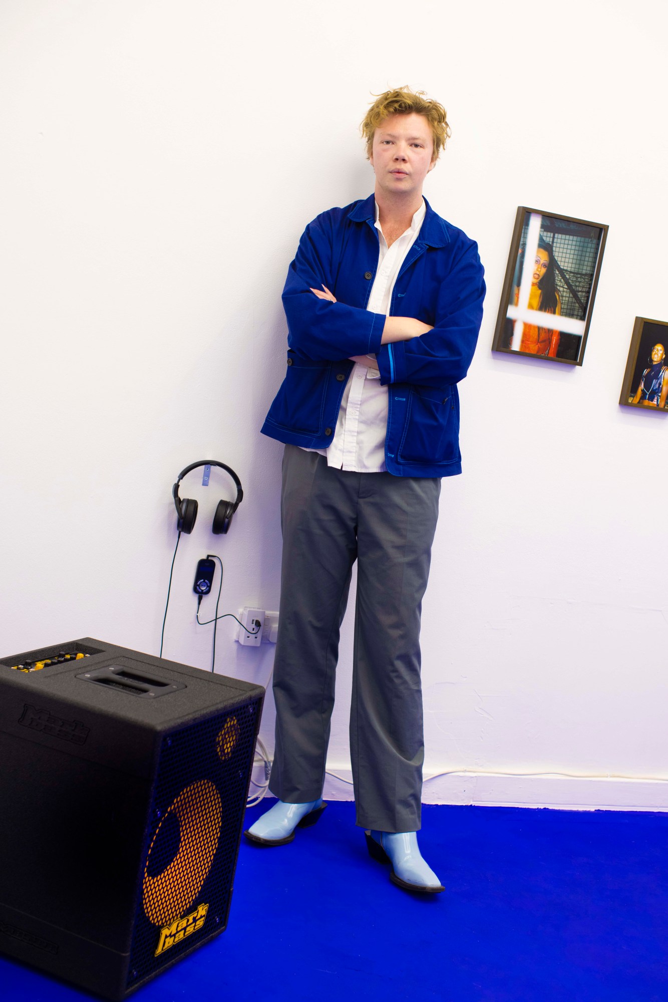 portrait of louis chapple in front of artwork in studio/chapple london