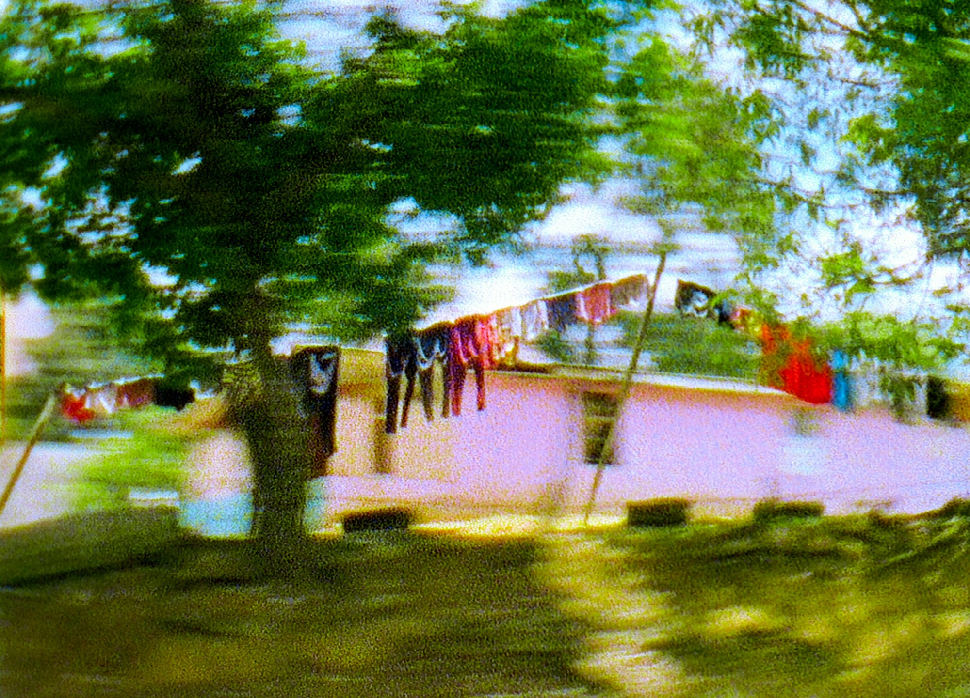 Photograph by Julian Klincewicz of clothes on a washing line outside a house