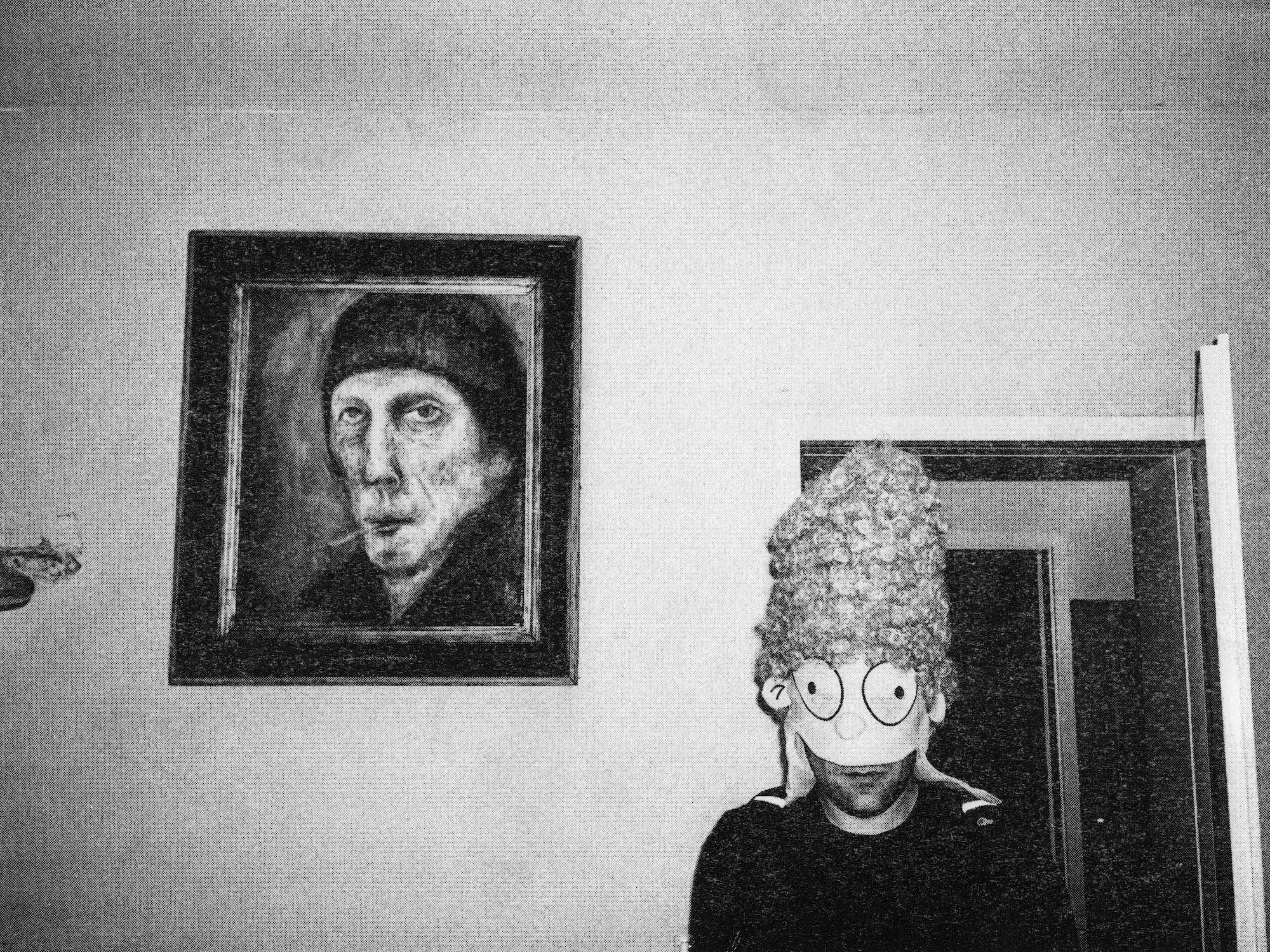 a man in a marge simpson mask standing next to a painted portrait of a man smoking