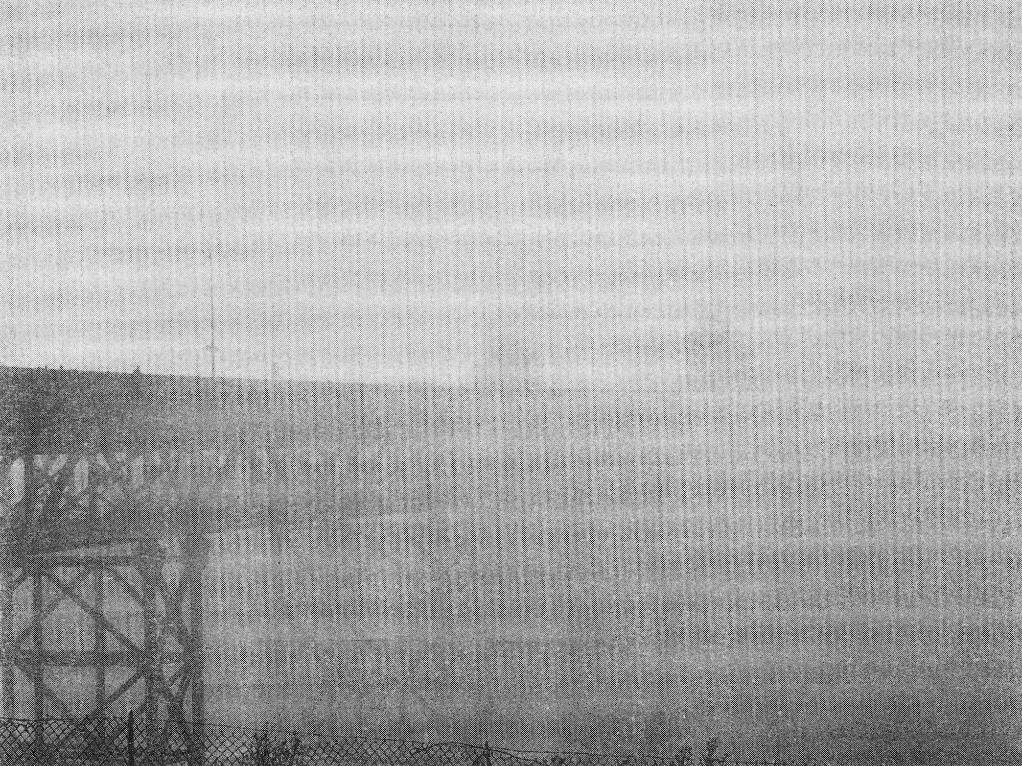 a foggy photo of a bridge